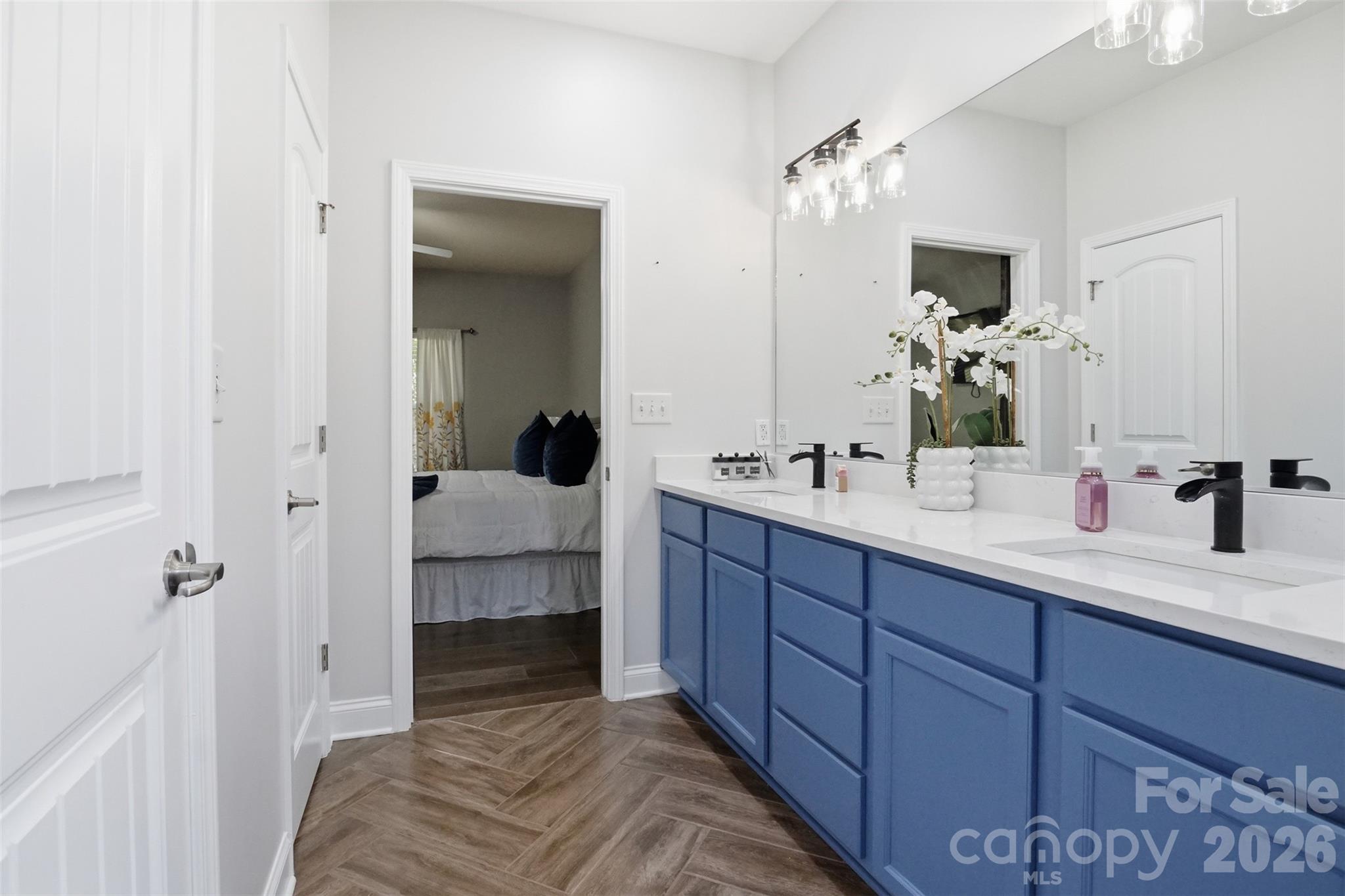 Primary custom closet system to the left and linen closet as you walk into the bathroom - 835 Estuary Court, Rock Hill