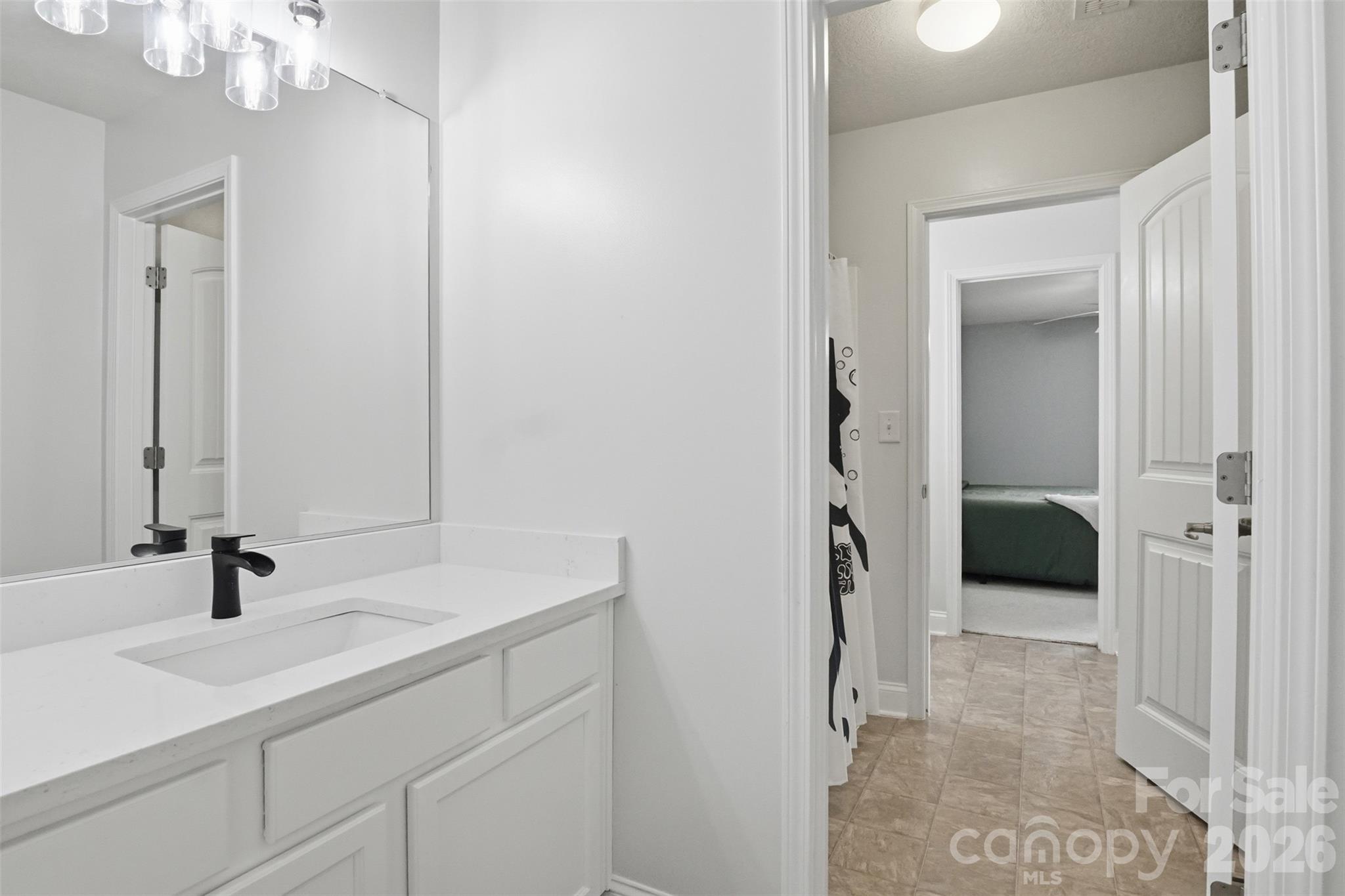 Jack-n-jill bathroom connected to bedrooms #3 and #4. Each bedroom has it's own private sink with upgraded white quartz countertop! - 835 Estuary Court, Rock Hill