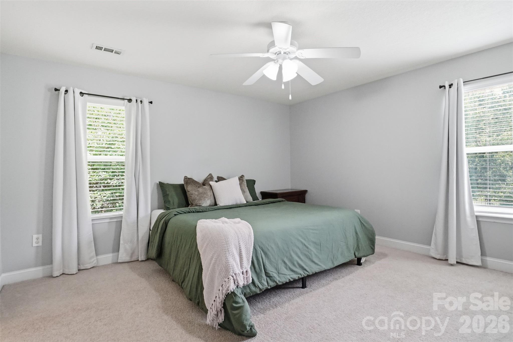 Bedroom #4 with ceiling fan and walk-in closet. King size bed still allows for plenty of space for large furniture! - 835 Estuary Court, Rock Hill