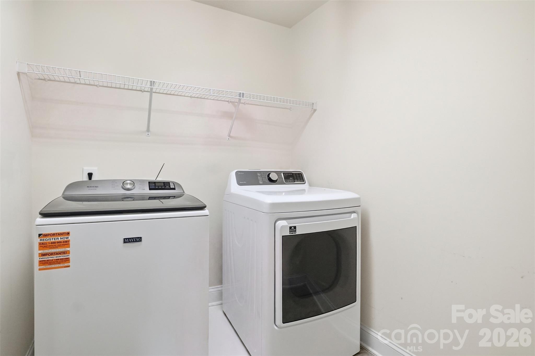 Laundry room is nestled upstairs off of the landing and in between 4 bedrooms for easy access! - 835 Estuary Court, Rock Hill