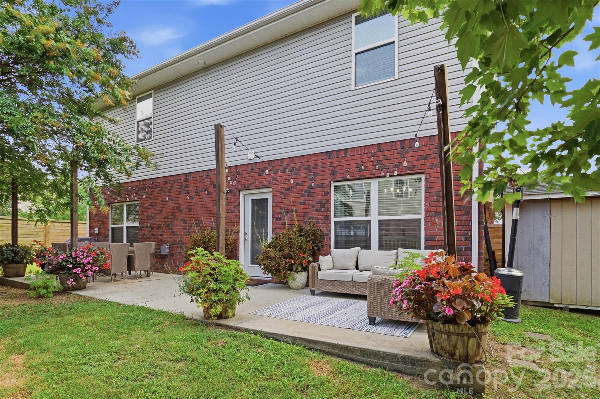 Backyard patio sanctuary with gorgeous cemented growing pots for those with a green thumb! - 835 Estuary Court, Rock Hill