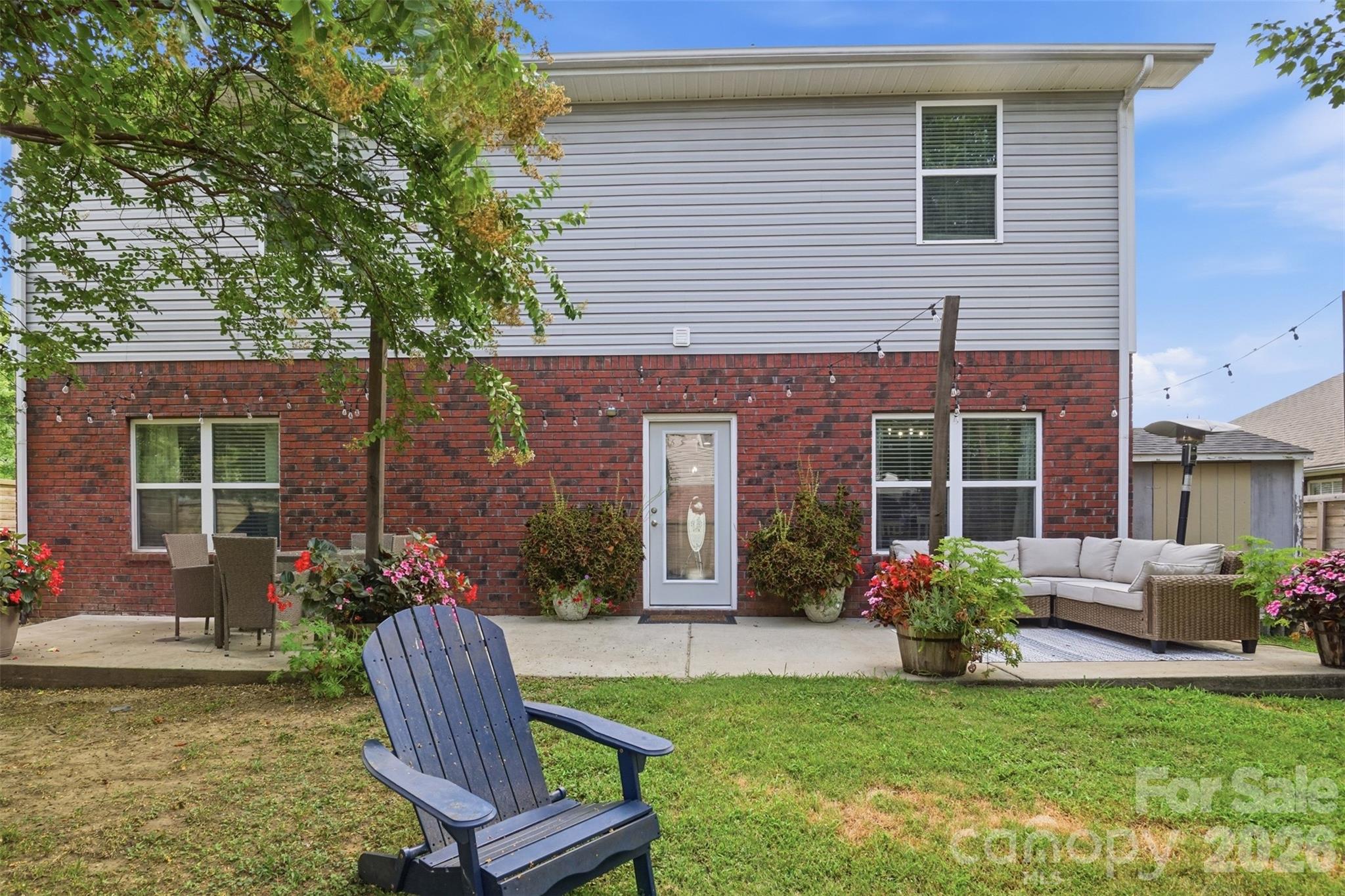 Backyard with portable firepit and extra storage in the shed to the right - 835 Estuary Court, Rock Hill