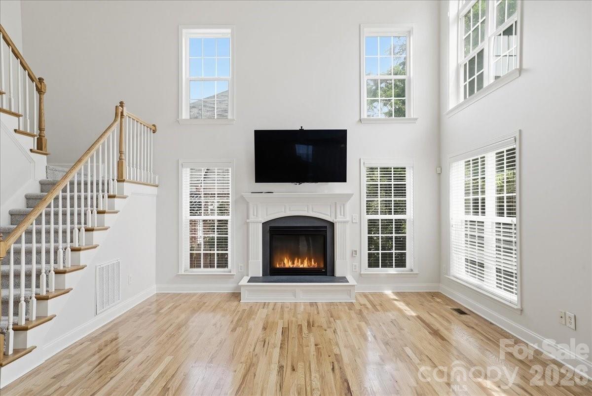 2-story great room with gas fireplace. Moveable heavy duty TV stand, TV included! - 6055 Latta Springs Circle, Huntersville
