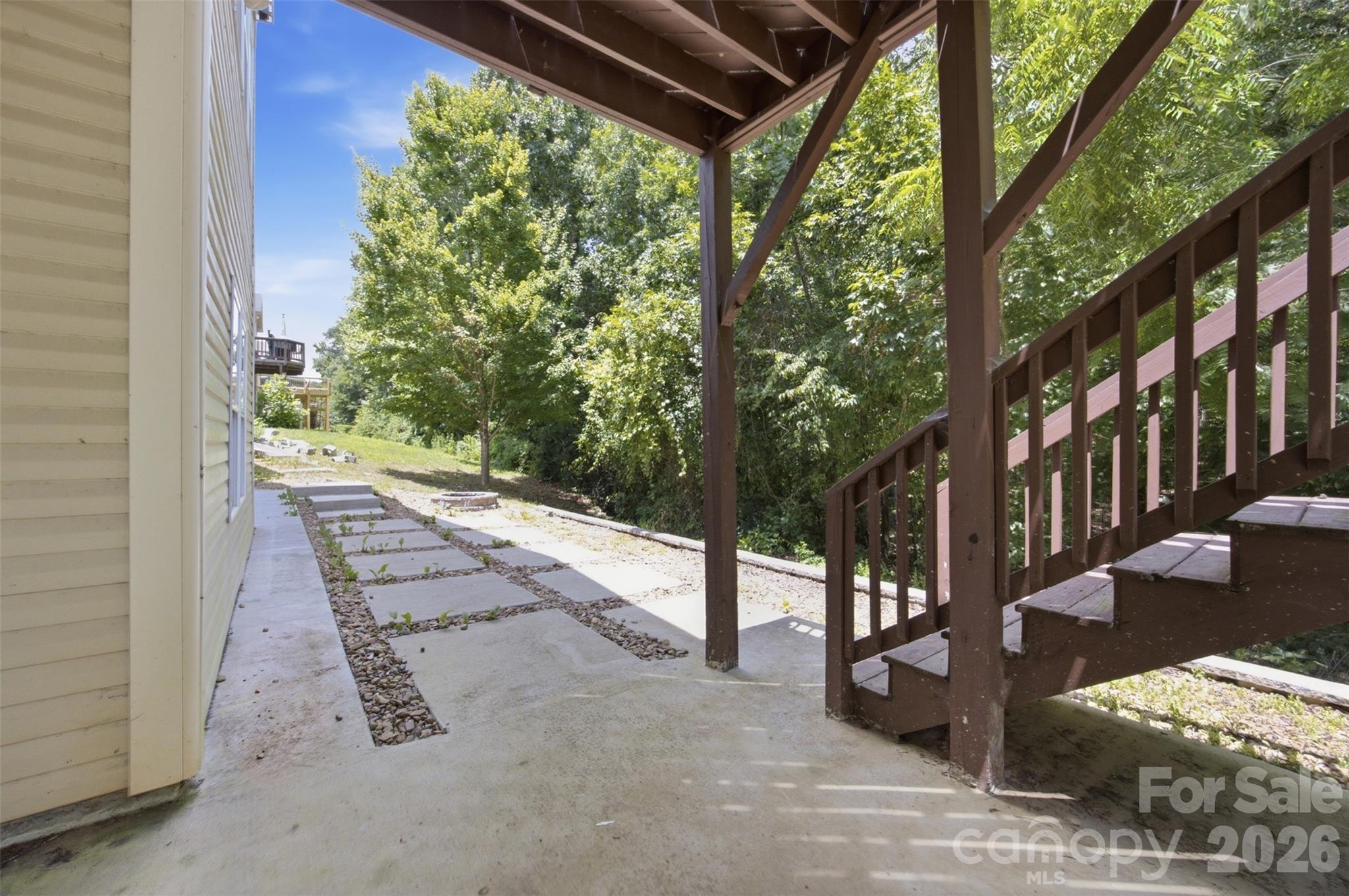Covered patio off the in-law suite providing additional outdoor living space - 423 Fischer Road, Fort Mill