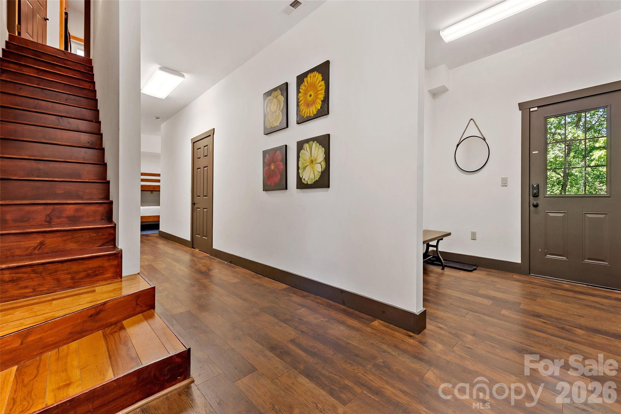 Stairs leading to main level from driveway level door. - 179 Rock Spring Road, Lake Lure