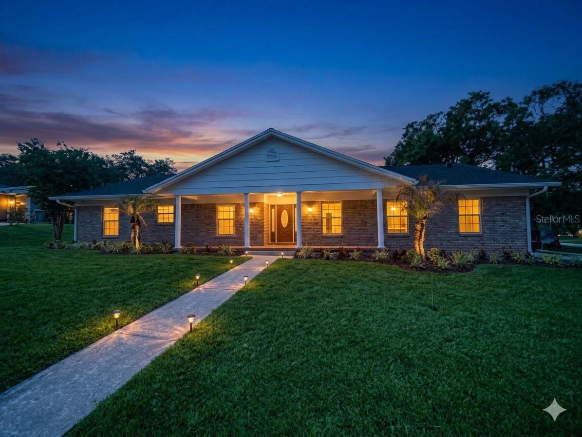 Front photo ai Virtually Enhanced to dusk - 1449 ERROL PKWY, APOPKA