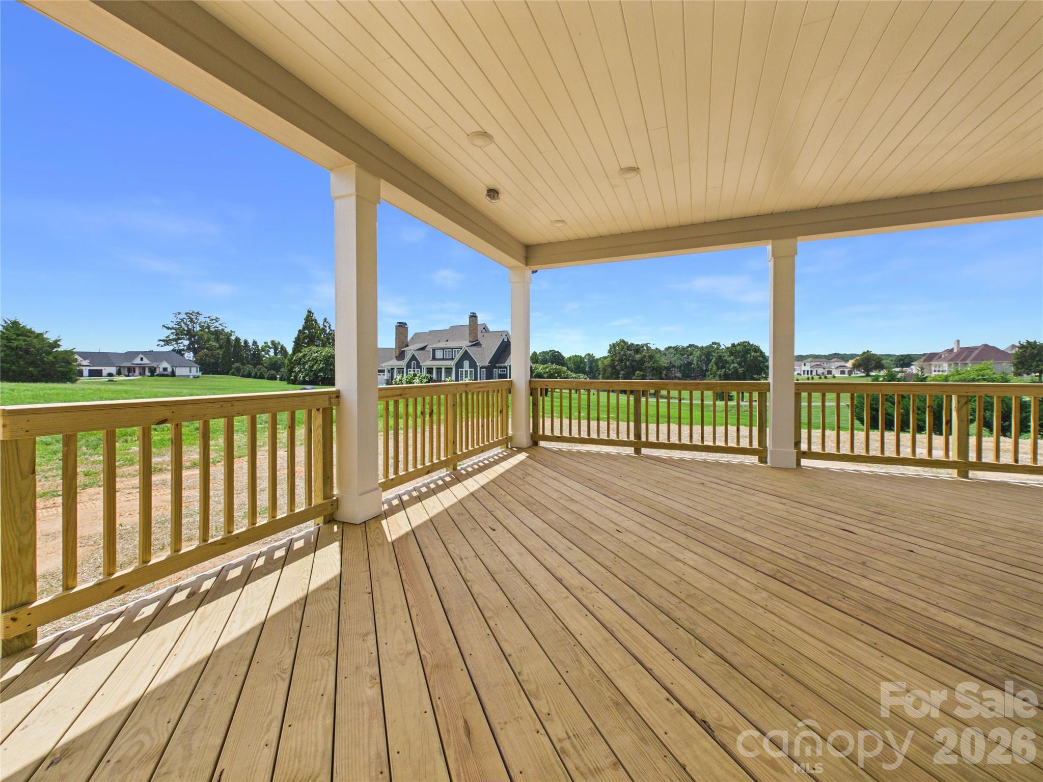Covered Deck off the Kitchen. Gas line available to add your outdoor kitchen/grilling area. - 1065 Rolling Meadows Drive, Mooresville