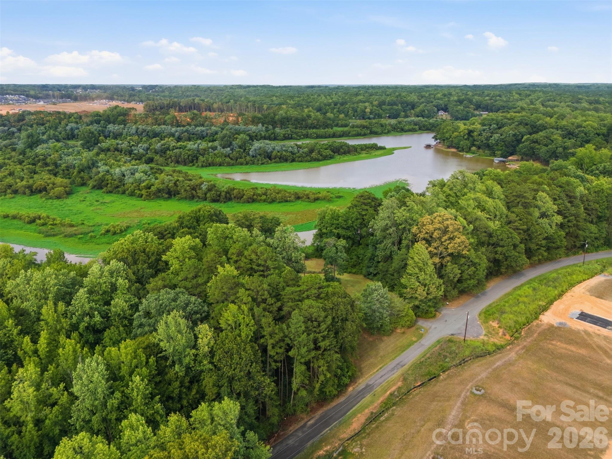 Waterfront Property LAKE WYLIE at South Fork of the Catawba River. You can see the roof top of the house and the new housing development going up across the street on Duck Cove Road. - 146 Duck Cove Road, Belmont