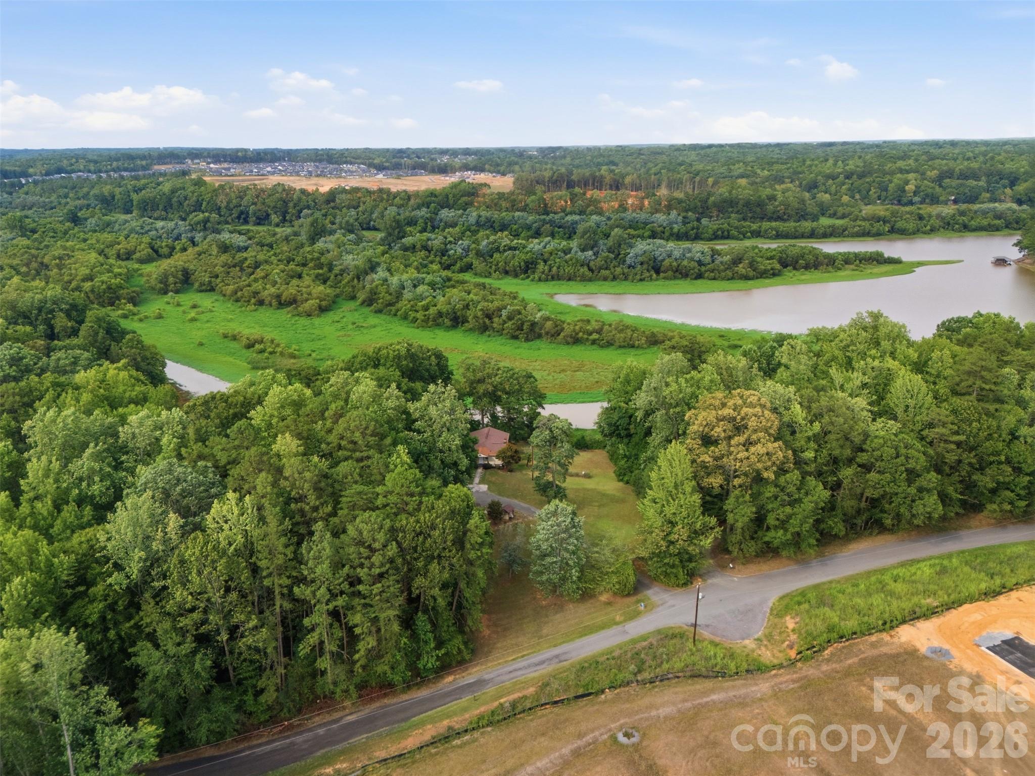 Waterfront Property LAKE WYLIE at South Fork of the Catawba River. You can see the roof top of the house and the new housing development going up across the street on Duck Cove Road. - 146 Duck Cove Road, Belmont