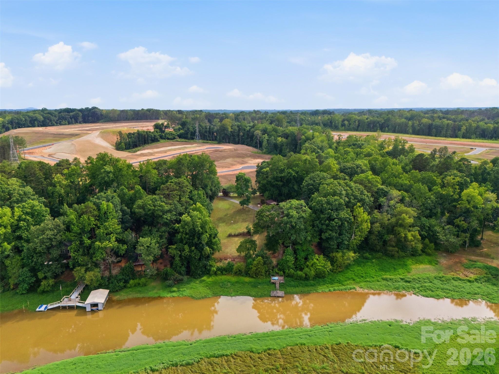 Waterfront Property LAKE WYLIE at South Fork of the Catawba River. You can see the roof top of the house and the new housing development going up across the street on Duck Cove Road. - 146 Duck Cove Road, Belmont