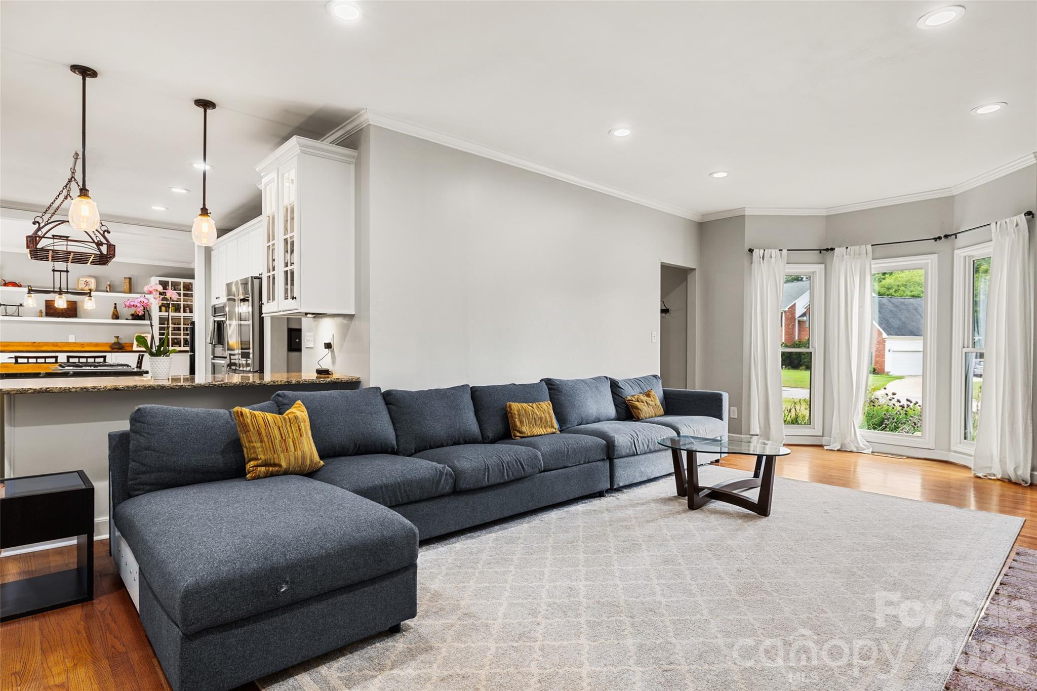 Living room holds a large sofa - 3375 Blue Jay Pass, Fort Mill