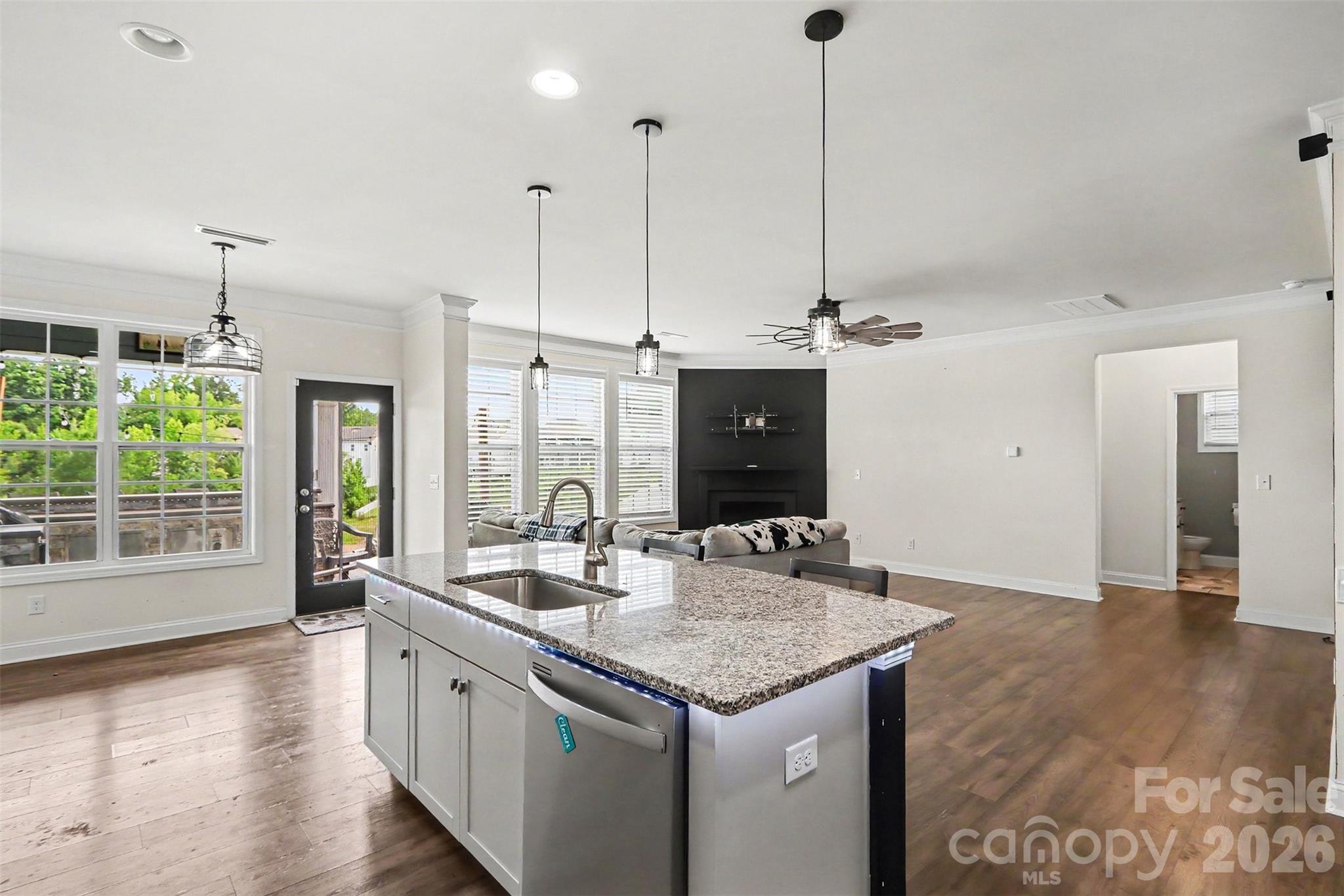 Kitchen with living room via - 124 Championship Drive, Mooresville