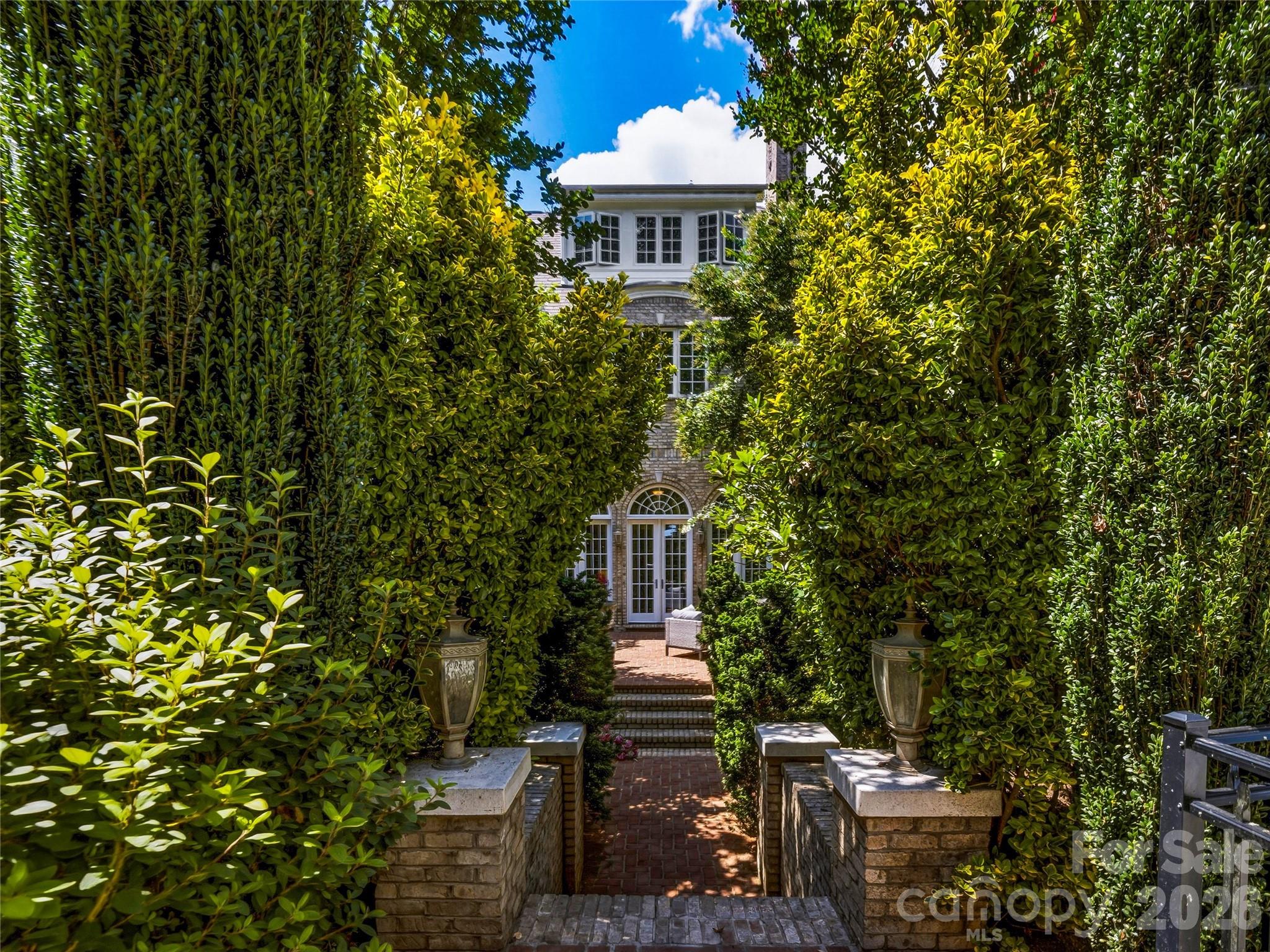 Gardens / Grounds Curated gardens. Meandering pathways. Ten private acres that feel like they were designed just for you. - 150 Rainbow View Drive, Fletcher
