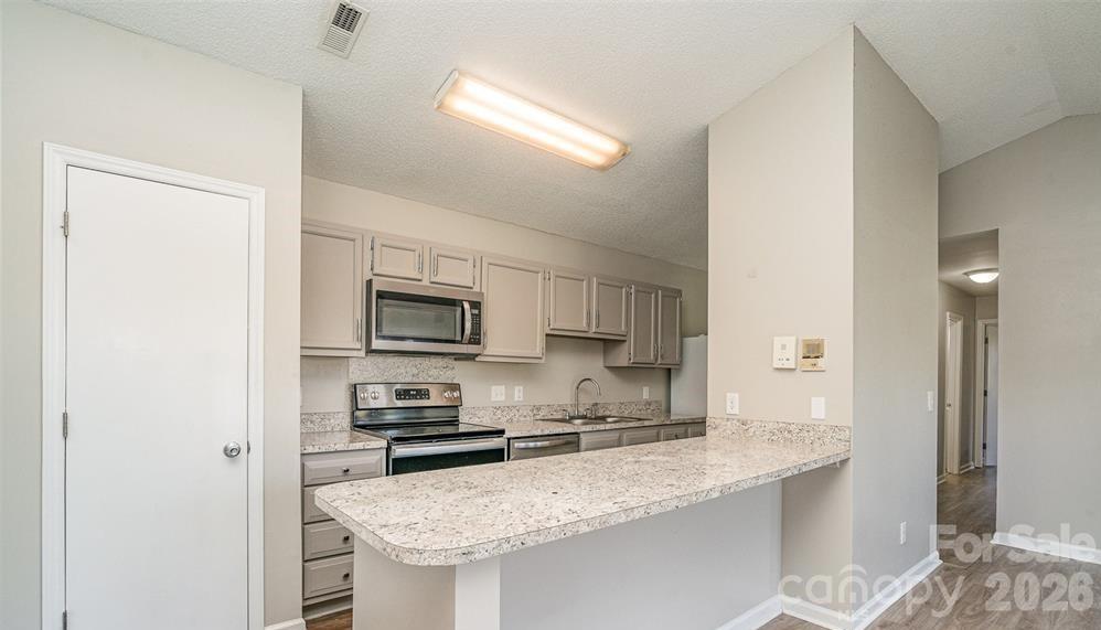 Breakfast bar or extra counter space - 6165 Meadow Rose Lane, Charlotte