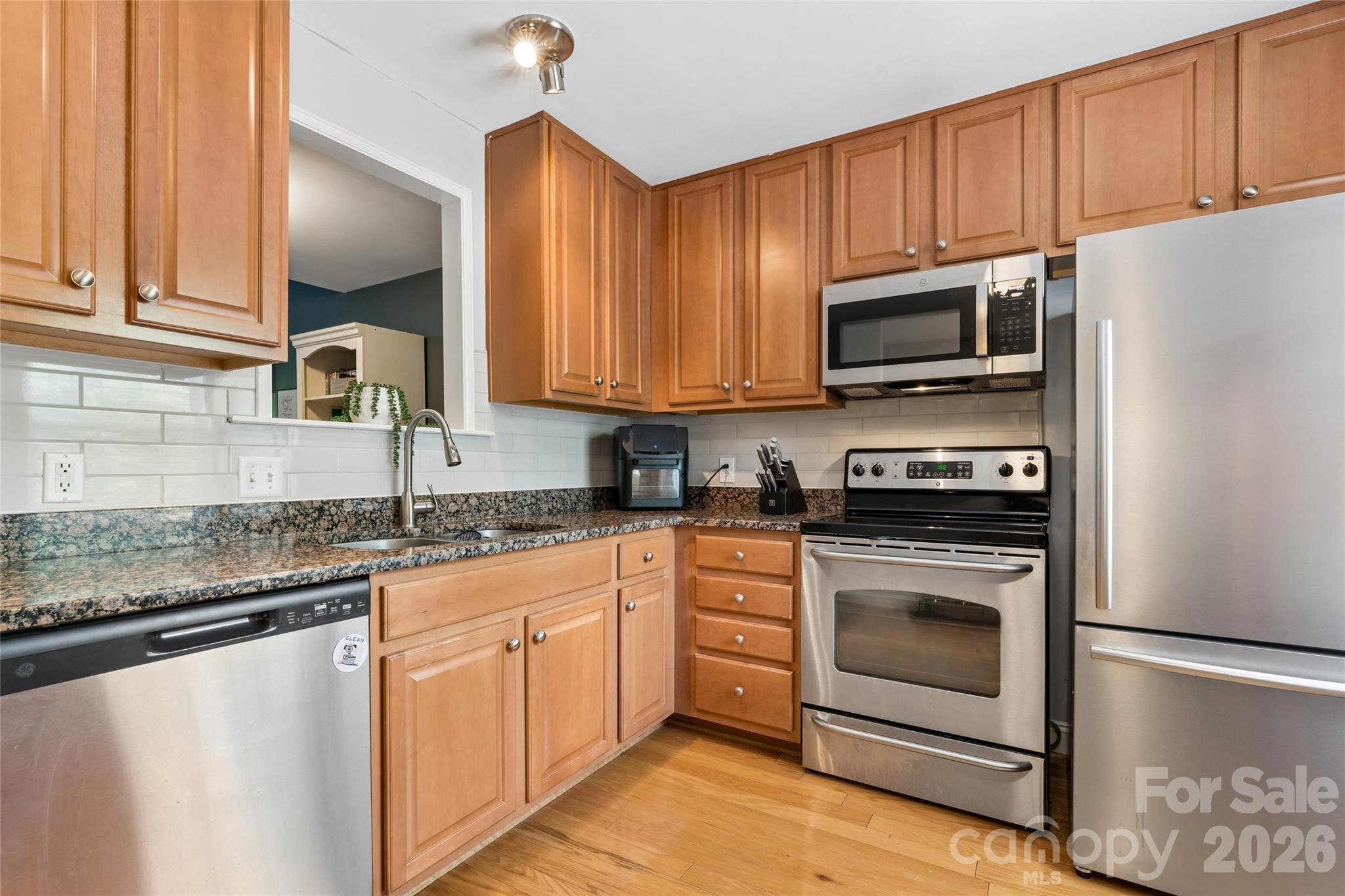 Kitchen with Stainless Steel appliances and a newly installed backsplash - 1806 Fairlawn Court, Rock Hill