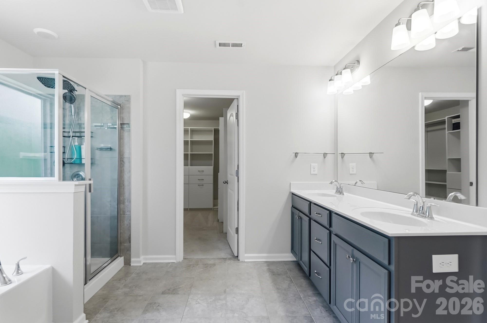 Primary Bath - Dedicated shower and large garden tub - 2nd floor - 9815 Caledenia Drive, Huntersville