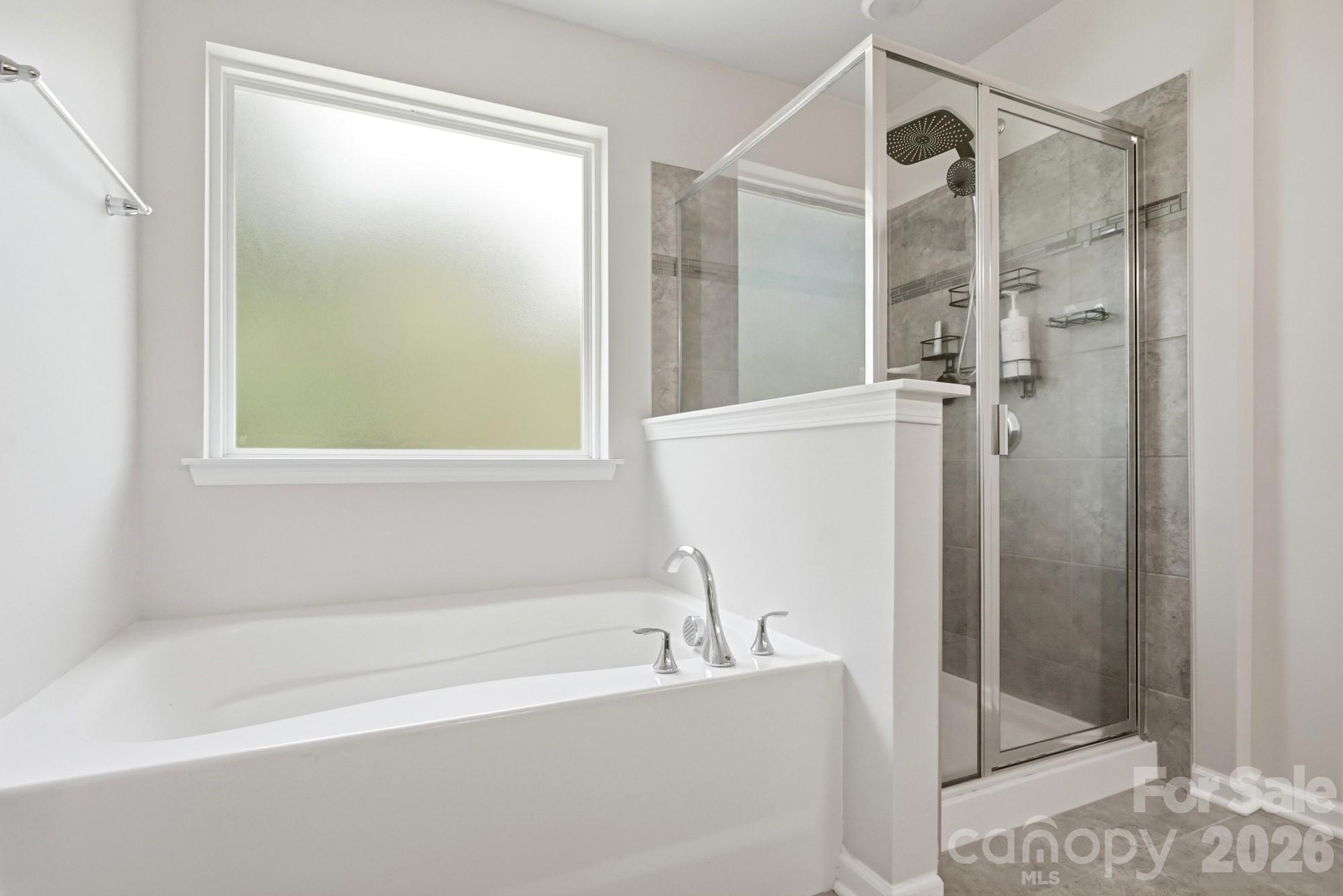 Primary Bath - Dedicated shower and large garden tub - 2nd floor - 9815 Caledenia Drive, Huntersville