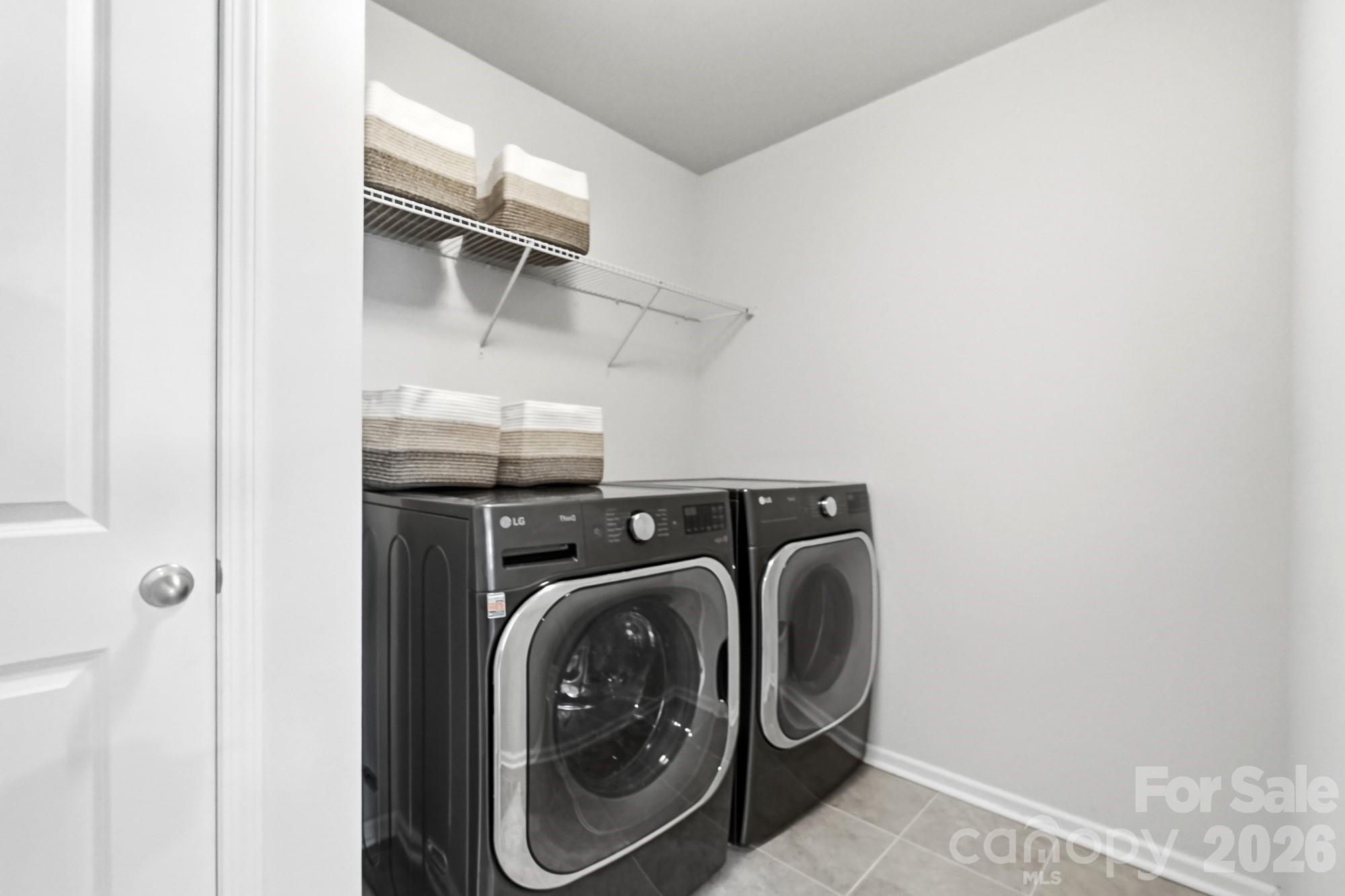 Dedicated laundry room with linen closet inside - 2nd floor - 9815 Caledenia Drive, Huntersville