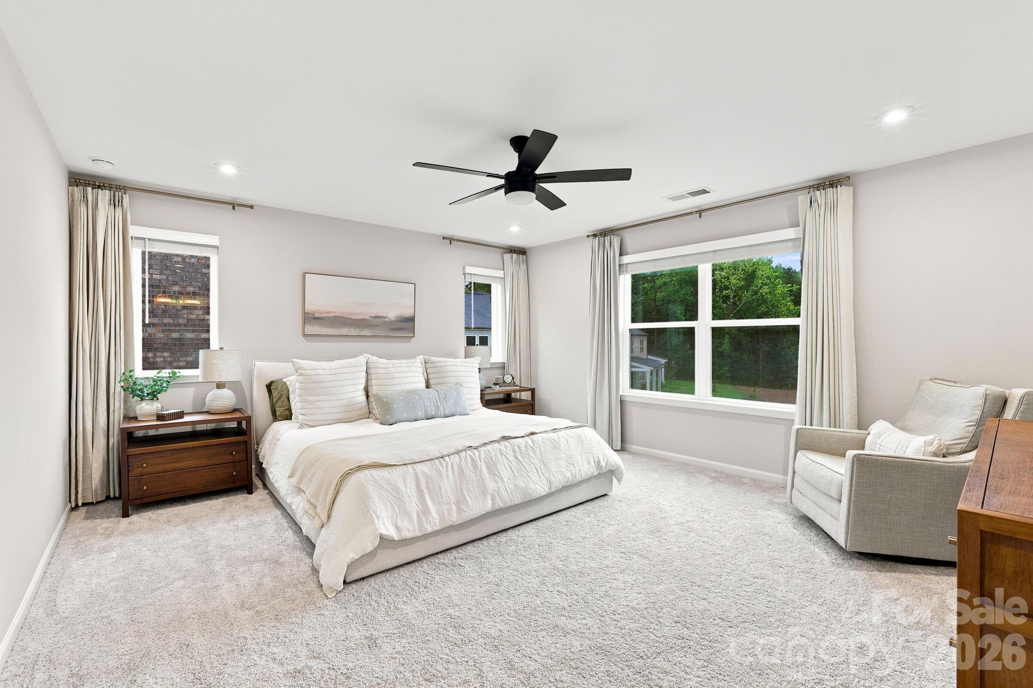 Oversized Primary Bed with lots of natural light- windows all have blinds too. And recessed lighting provides light as well - 8226 Franklin Trail Street, Mint Hill