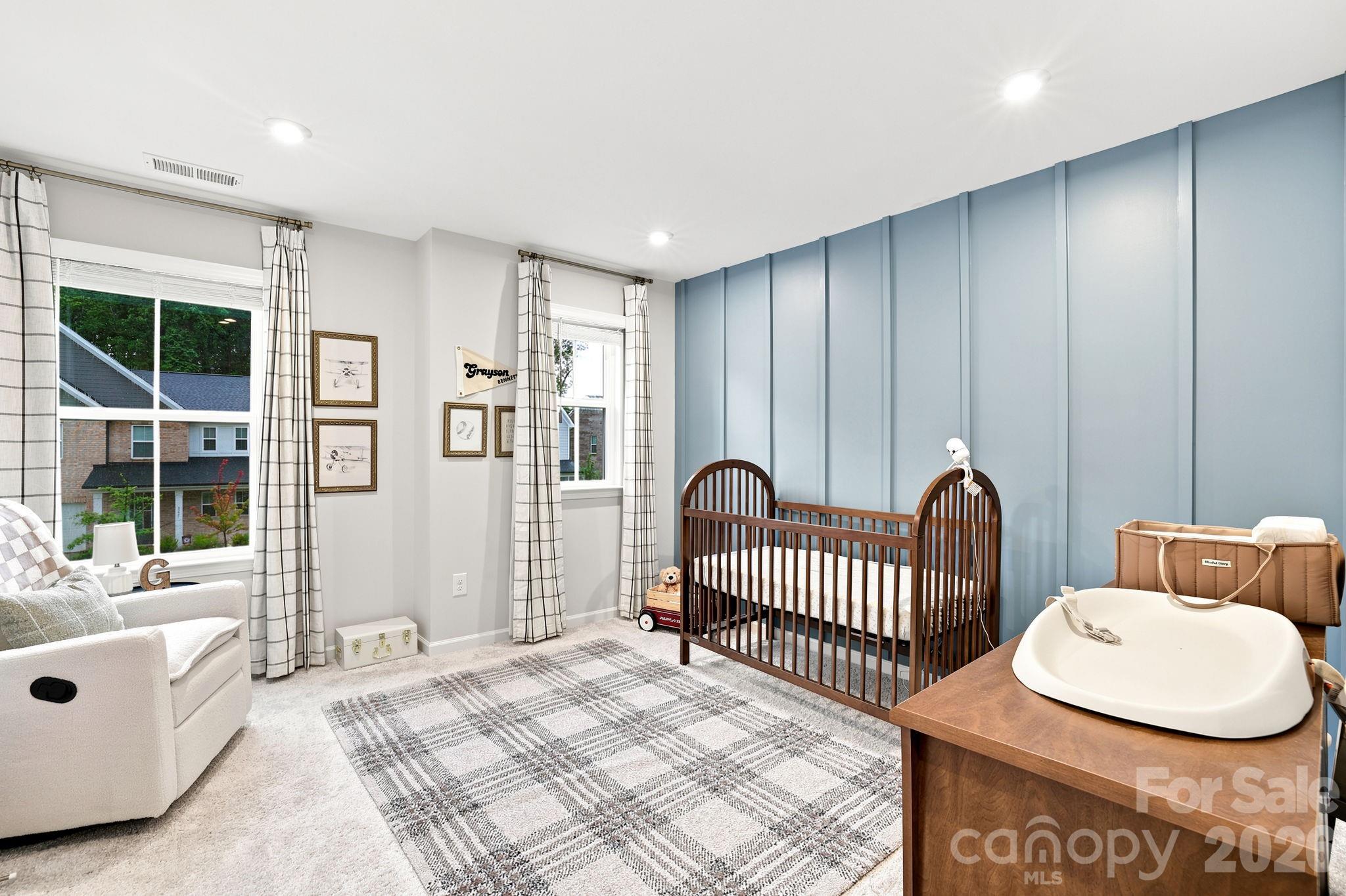 Bed 2 has panel accent wall and recessed lighting and abundant natural light. Nice size closet too! - 8226 Franklin Trail Street, Mint Hill