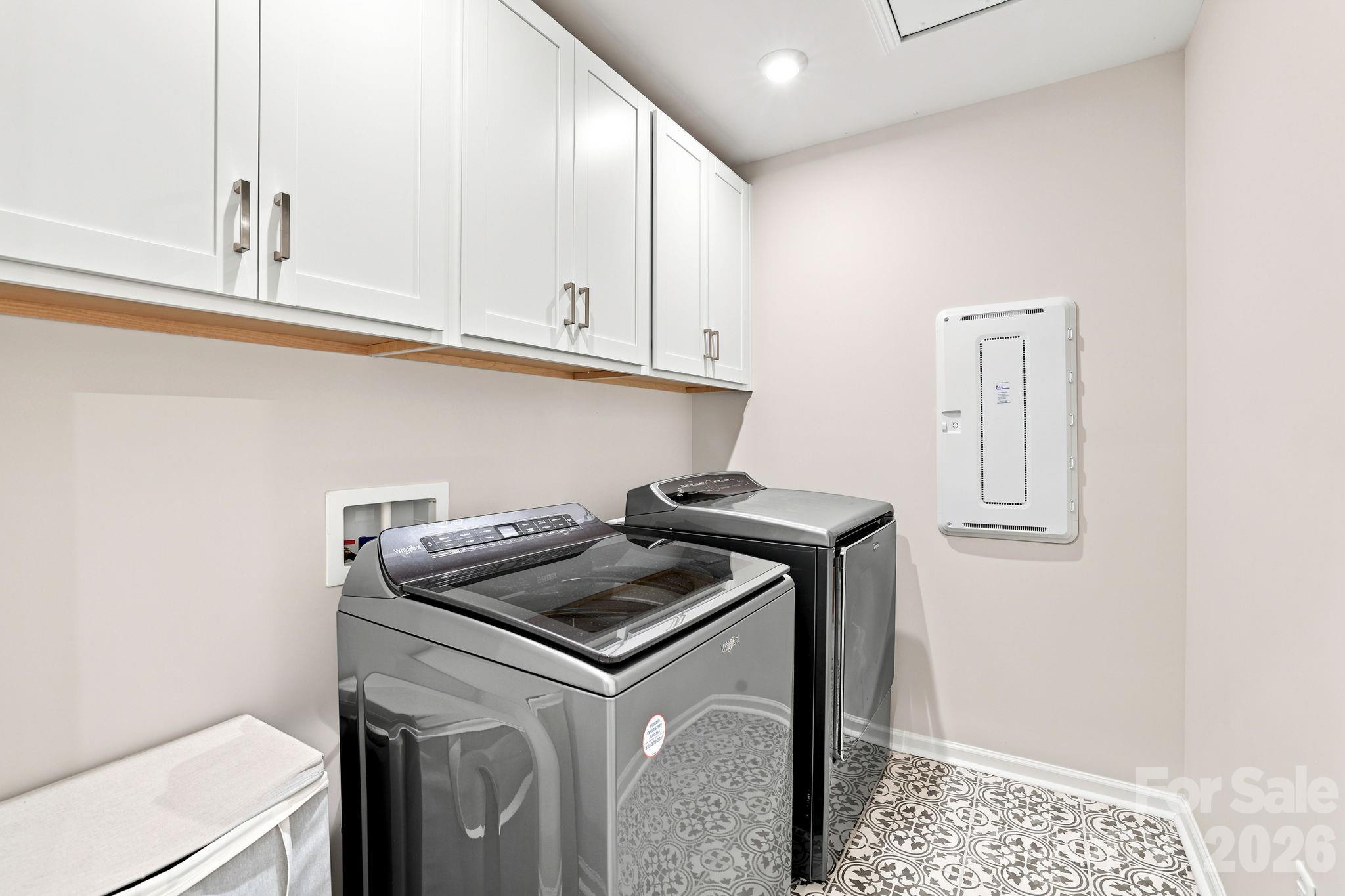 Oversized laundry room has cabinets and plenty of space to add more! - 8226 Franklin Trail Street, Mint Hill