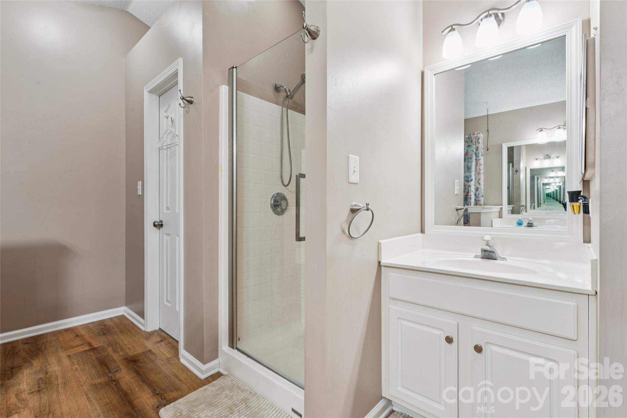primary bathroom with walk in shower and soaking tub - 5645 Winslow Avenue NW, Concord
