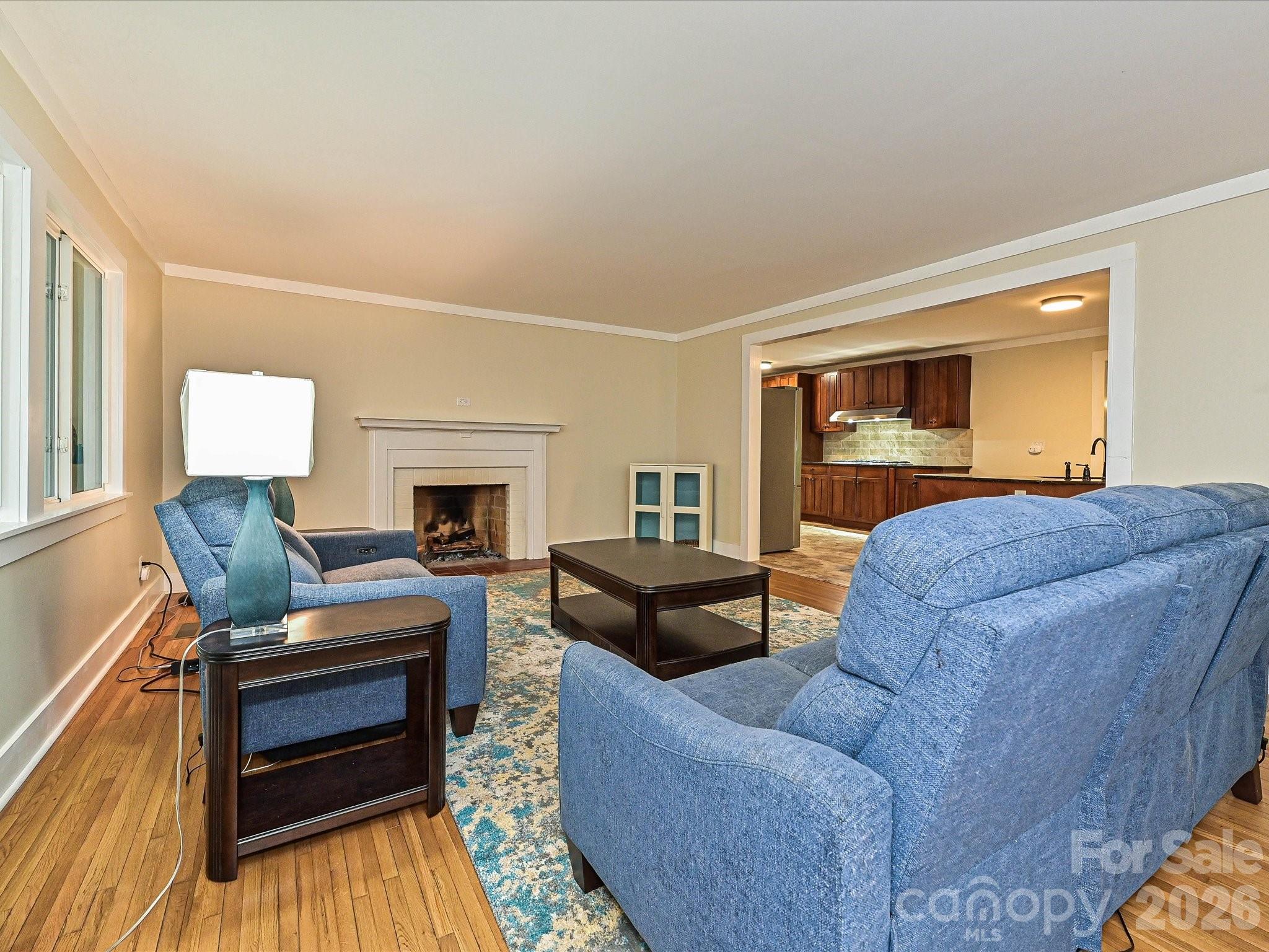 Living room w/ wood burning fireplace - 3115 Potter Road S, Waxhaw