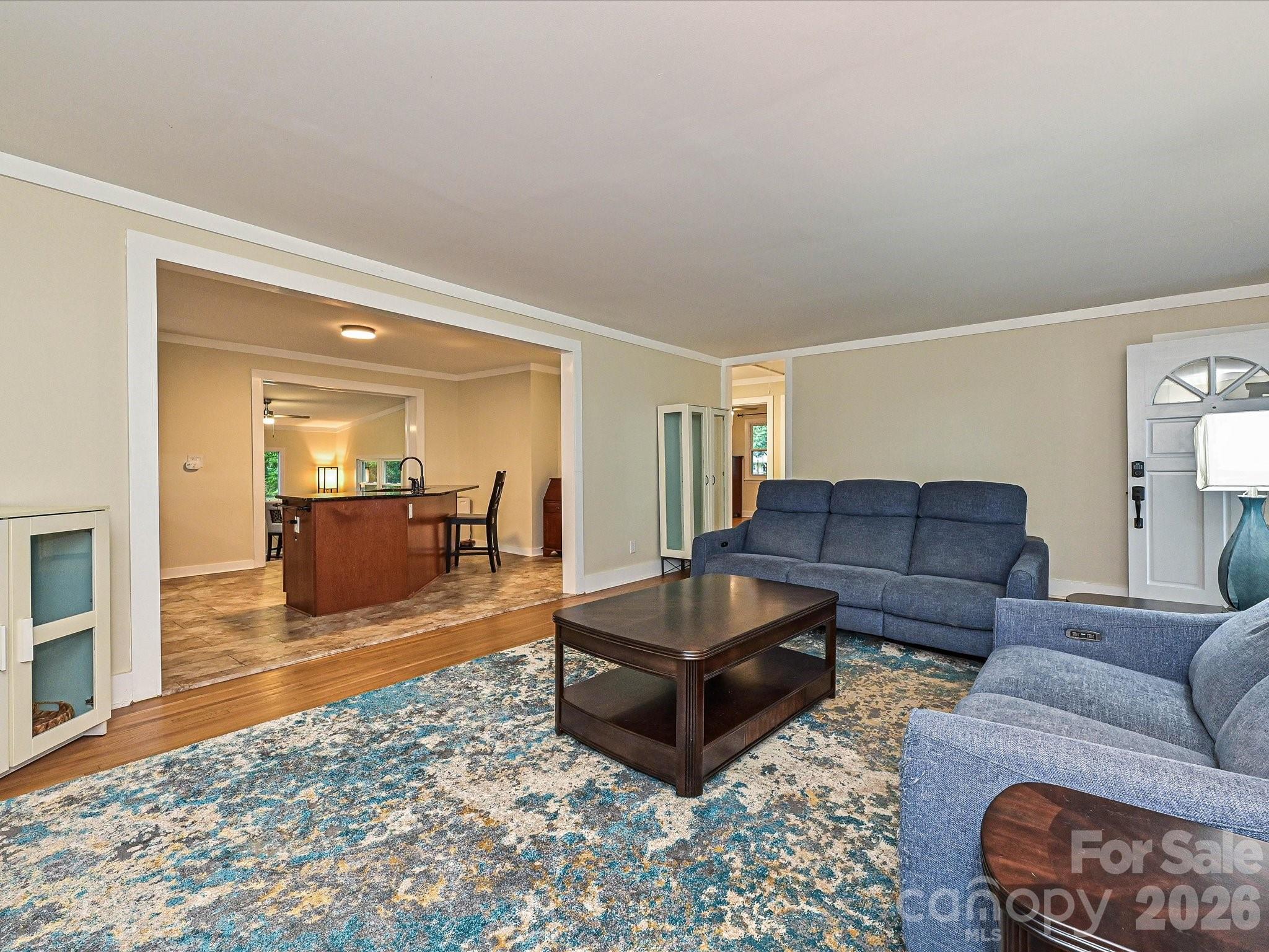 Living room flows into kitchen area - 3115 Potter Road S, Waxhaw