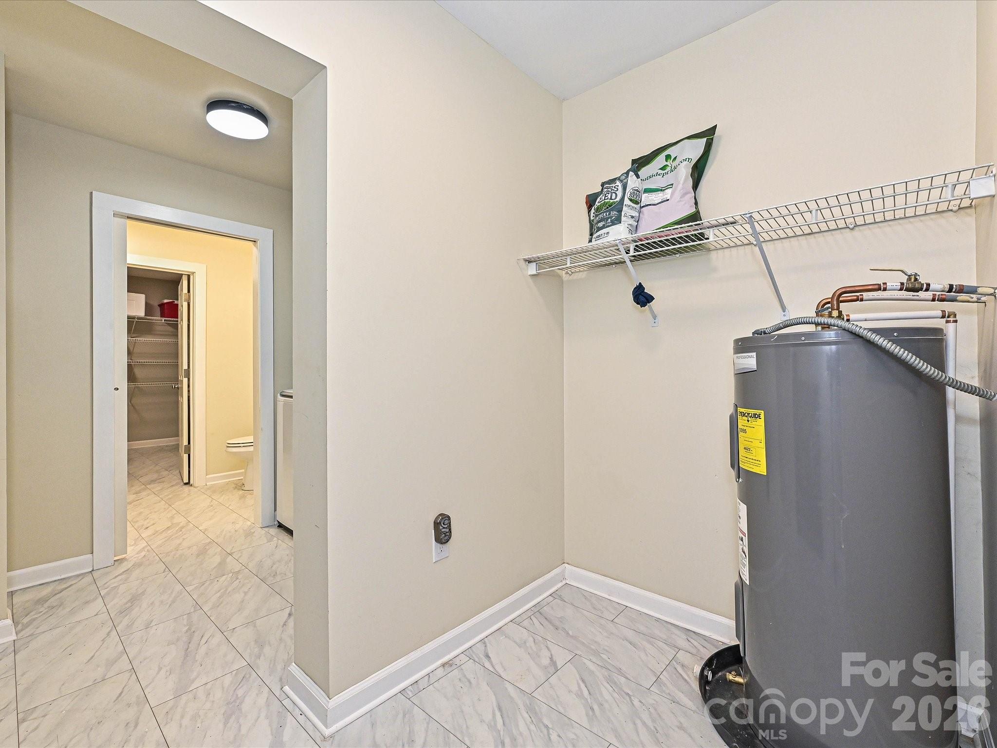 Located off kitchen pass thru drop zone to laundry room - 3115 Potter Road S, Waxhaw