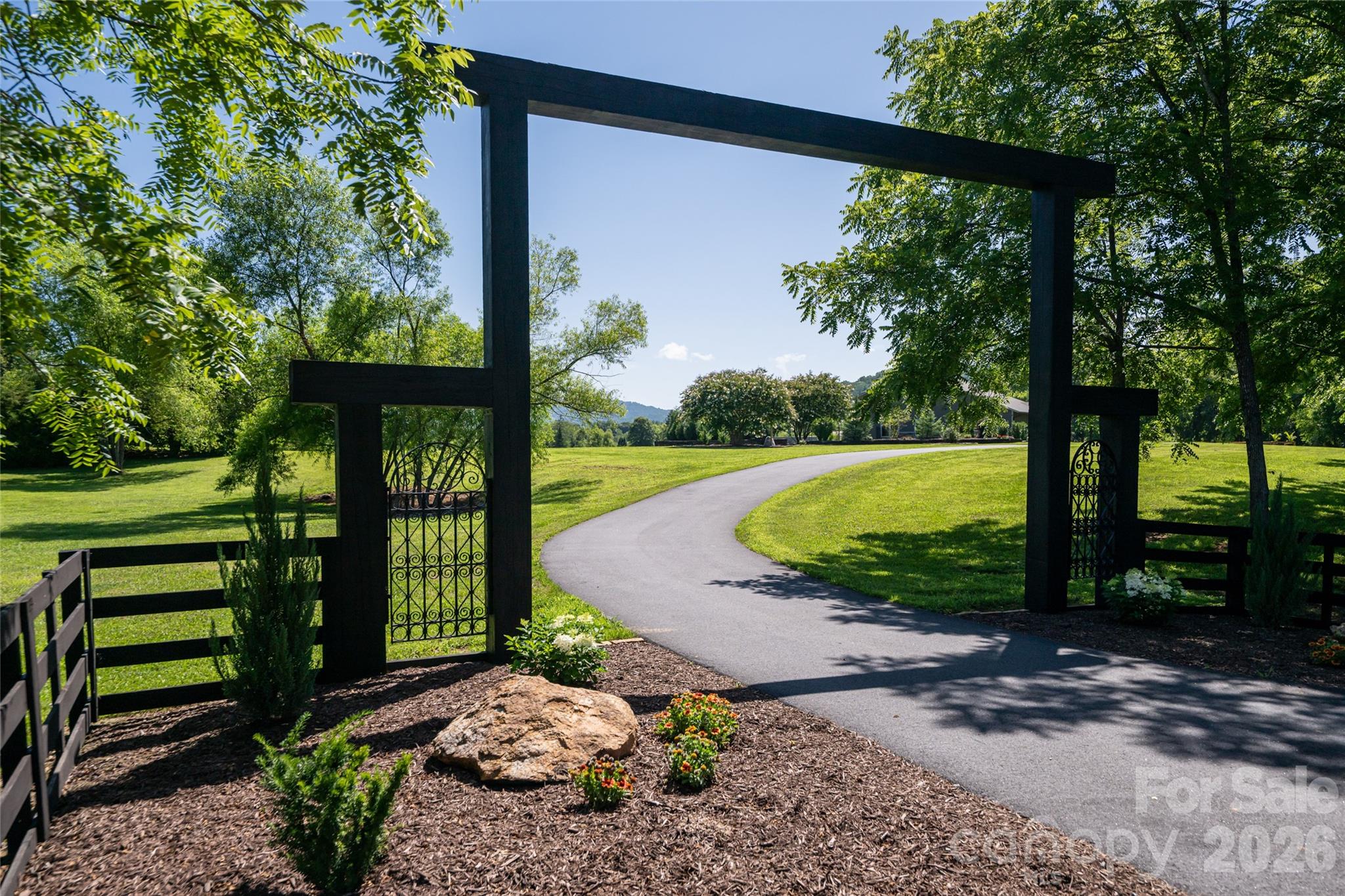 Drive through your entrance to almost 10 acres. - 660 Pleasant Grove Road, Hendersonville