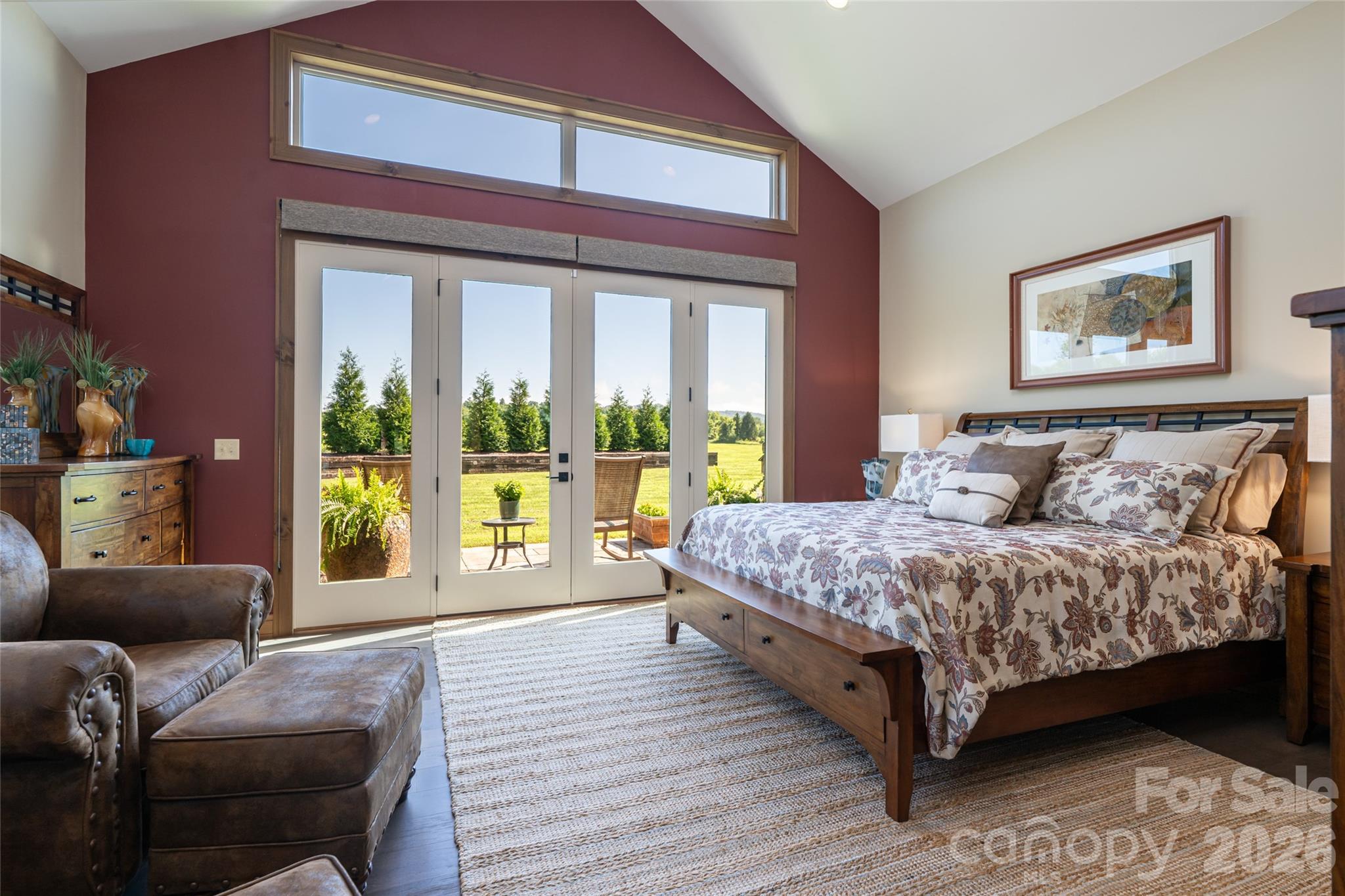Primary suite with soaring cathedral ceilings and a beautiful long range view. - 660 Pleasant Grove Road, Hendersonville