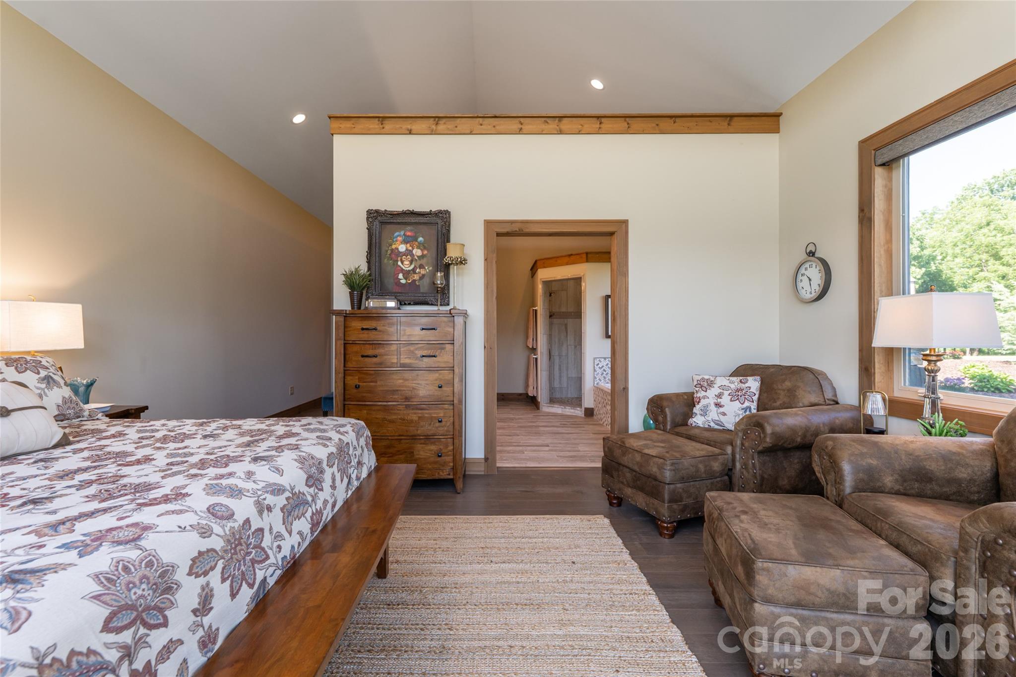 View from the primary bedroom into the spacious ensuite bathroom. - 660 Pleasant Grove Road, Hendersonville