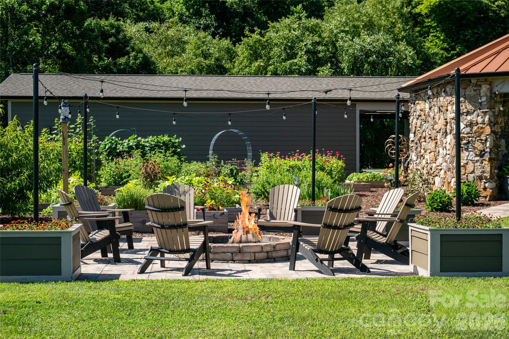 Fire pit and raised bed garden. - 660 Pleasant Grove Road, Hendersonville