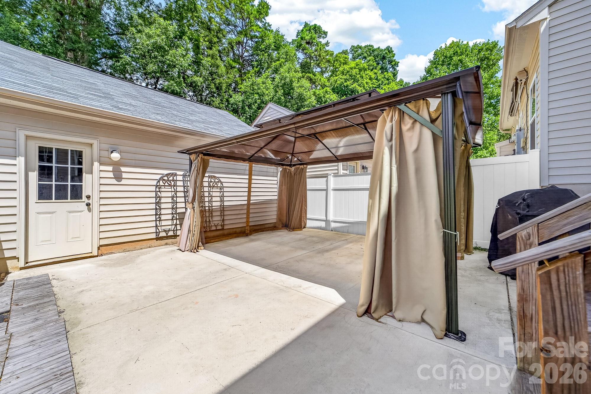 Back Patio with detached garage - 8261 Bridgegate Drive, Huntersville