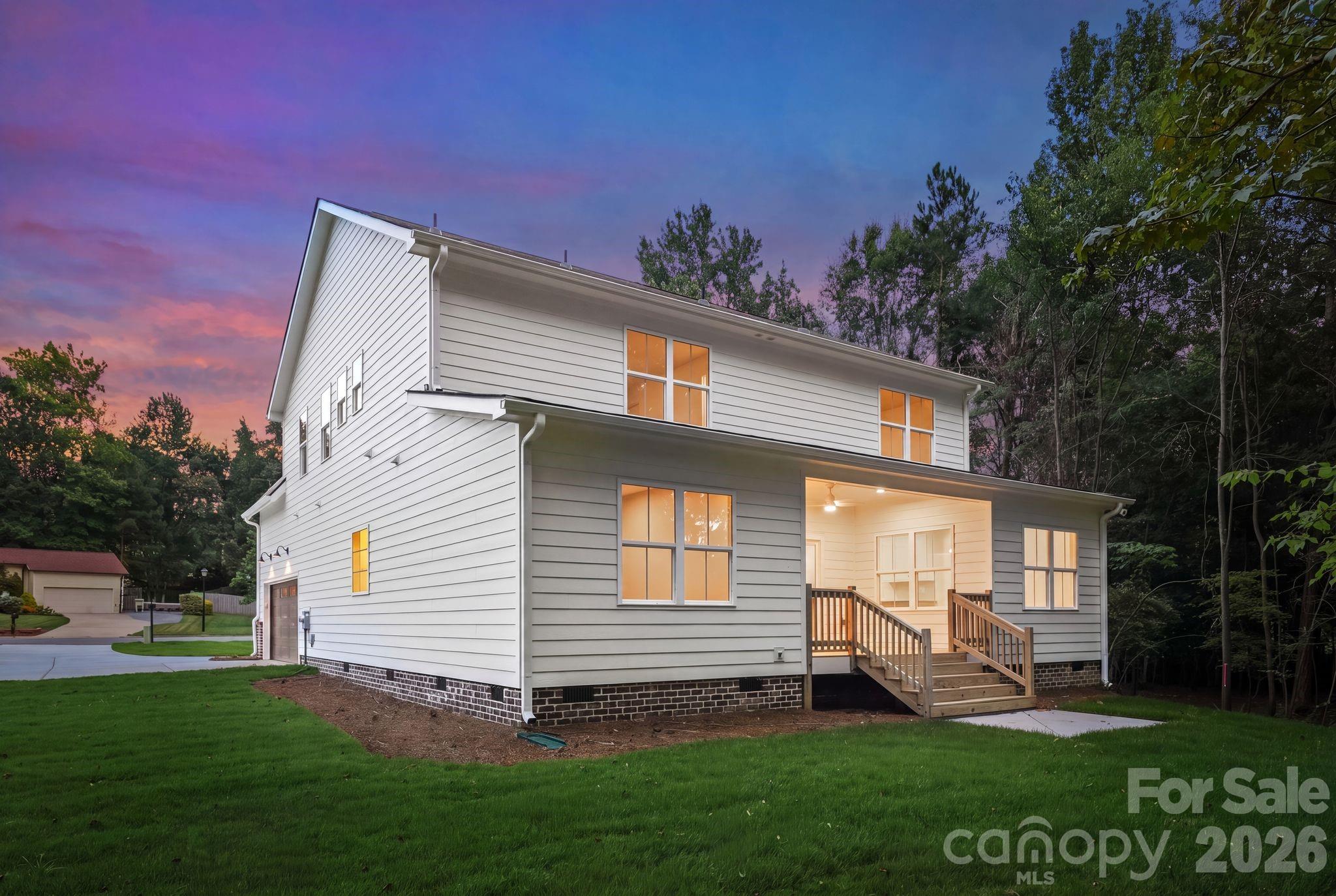 Rear exterior view at twilight. - 2311 Chateau Court, Matthews