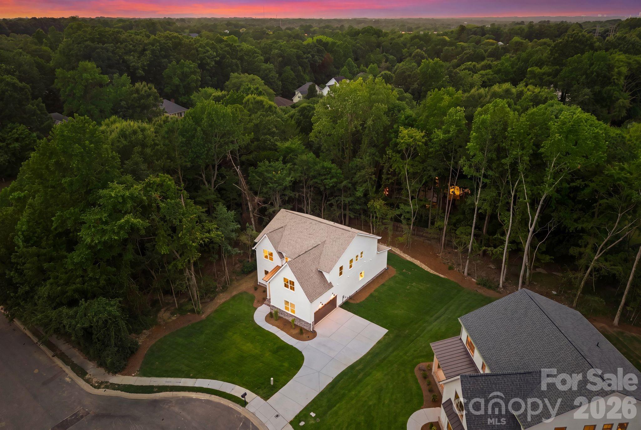 Aerial view at twilight. - 2311 Chateau Court, Matthews