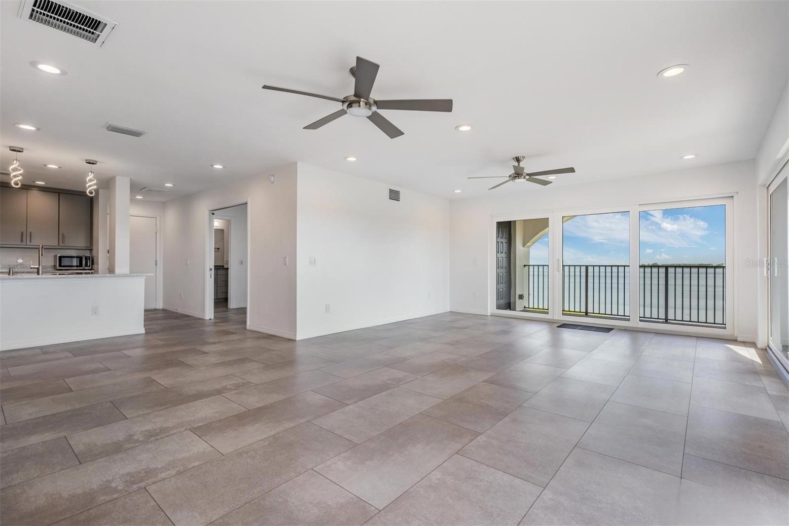 View from Dining Room to Living and Kitchen - 243 MARINER DR #243, TARPON SPRINGS