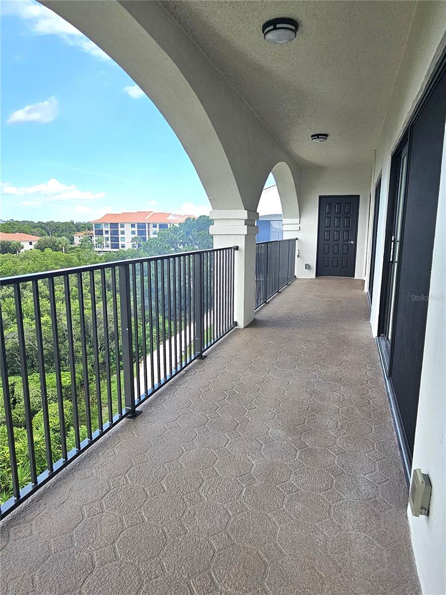 Side Balcony Showing 1 of 2 A/C Storage Rooms - 243 MARINER DR #243, TARPON SPRINGS