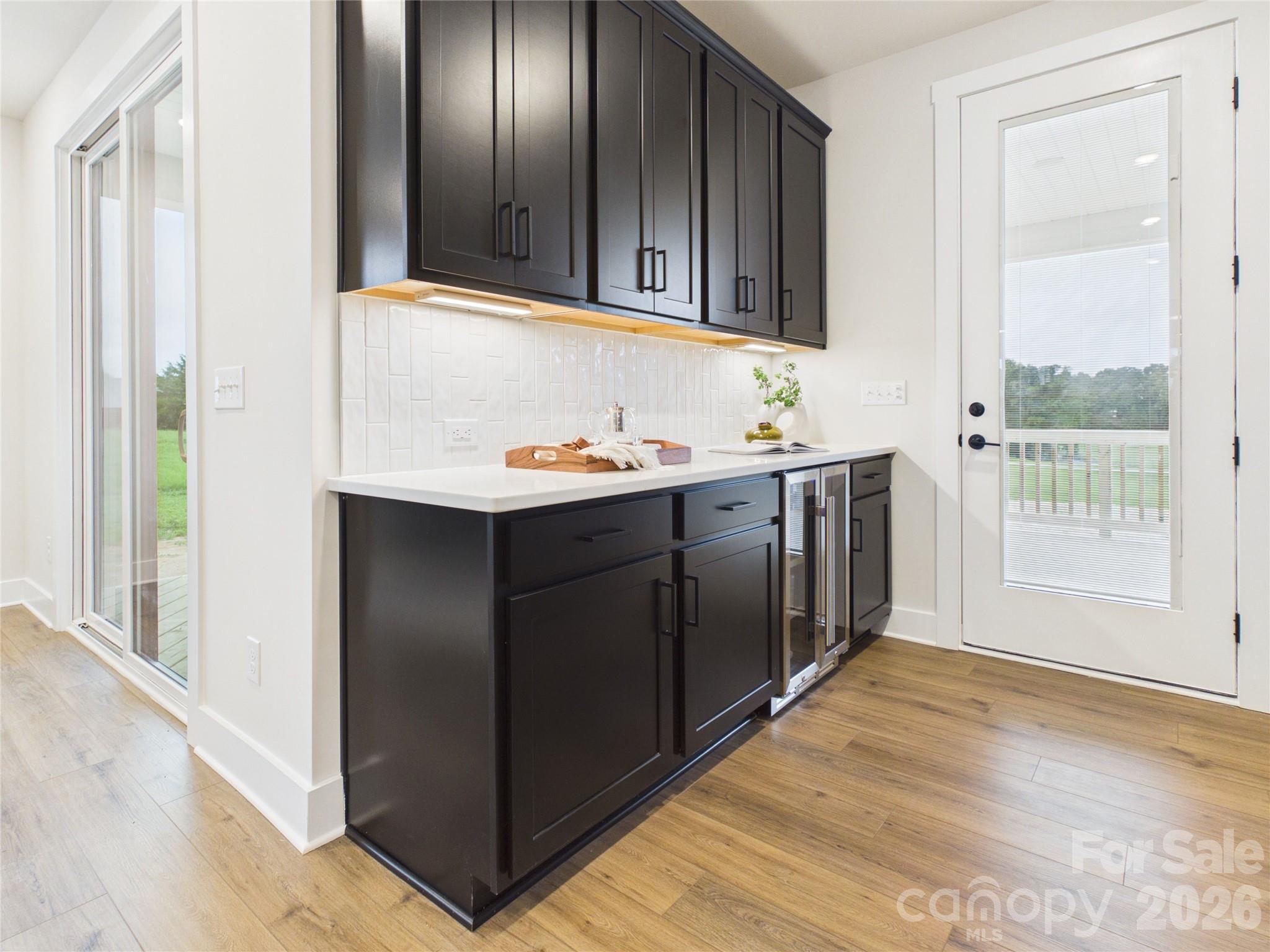 Butler's pantry with door to covered deck - 1065 Rolling Meadows Drive, Mooresville