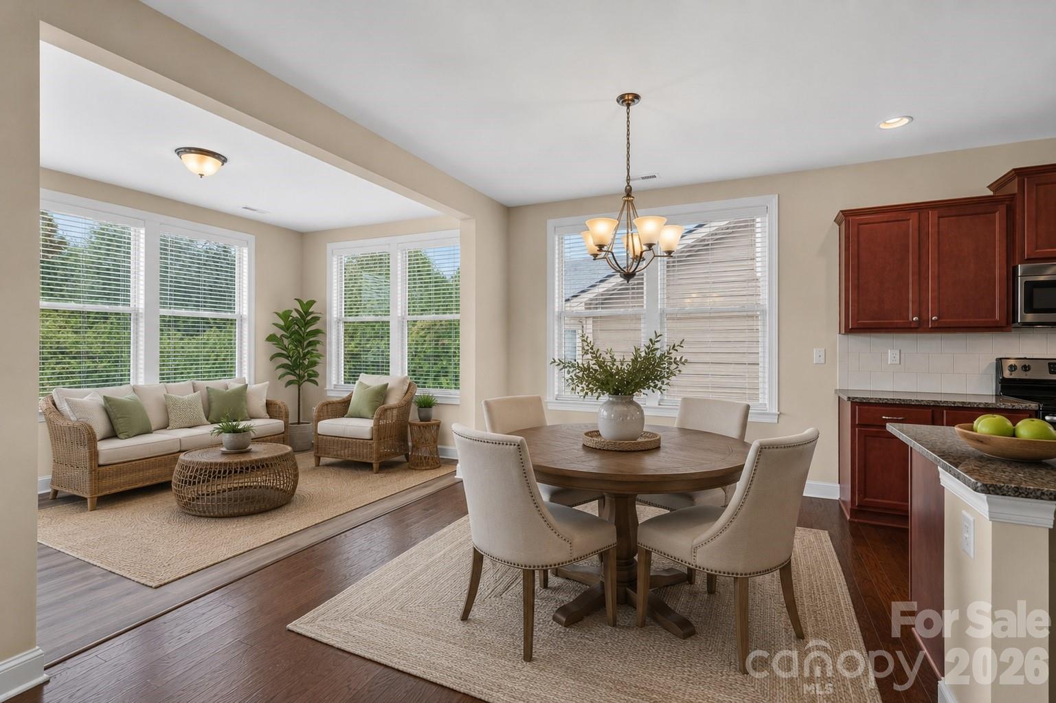 Virtually staged breakfast area with sunroom in back - 127 Johnson Manor Street, Mooresville