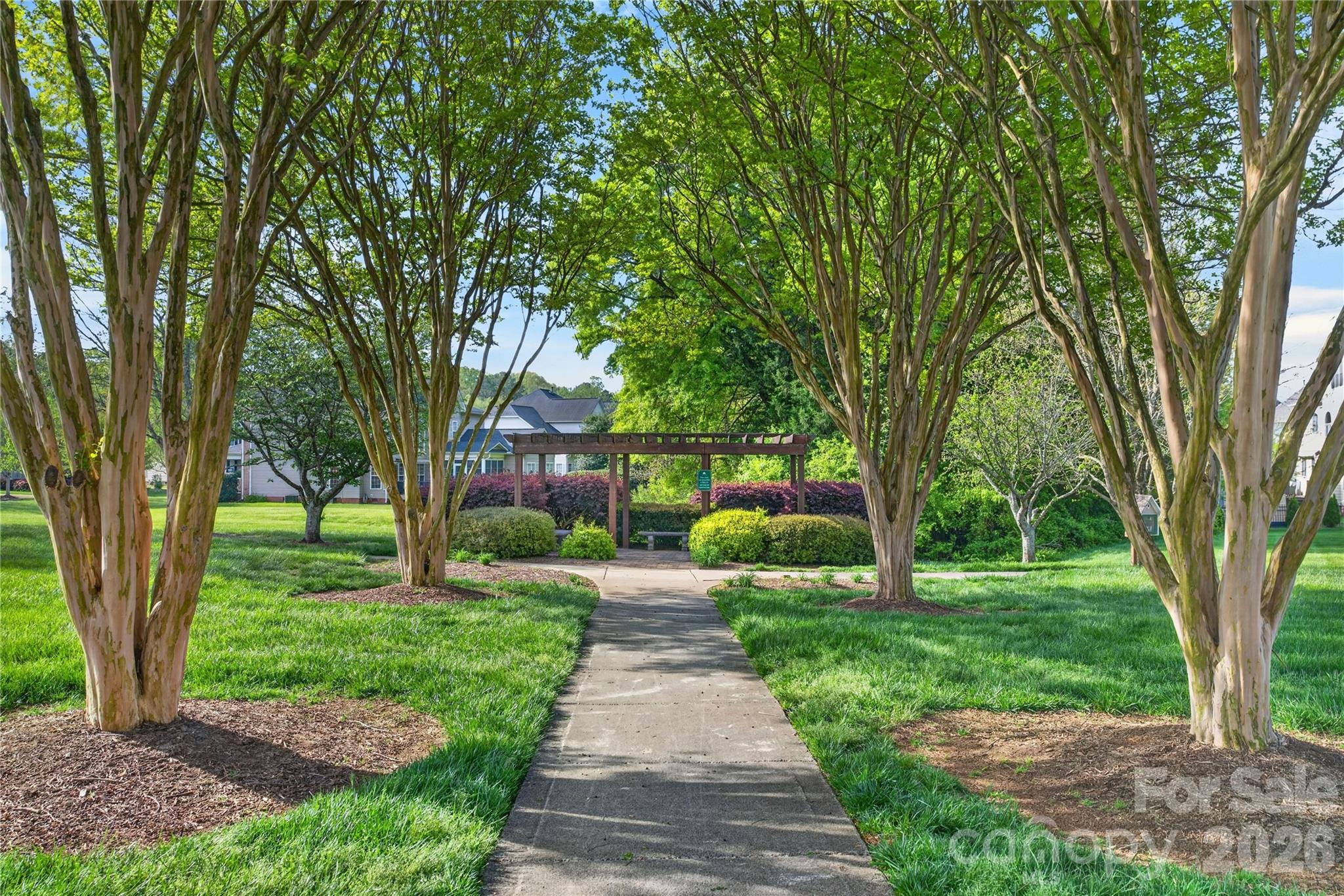 Open space with pergola in center of neighborhood. - 6055 Latta Springs Circle, Huntersville