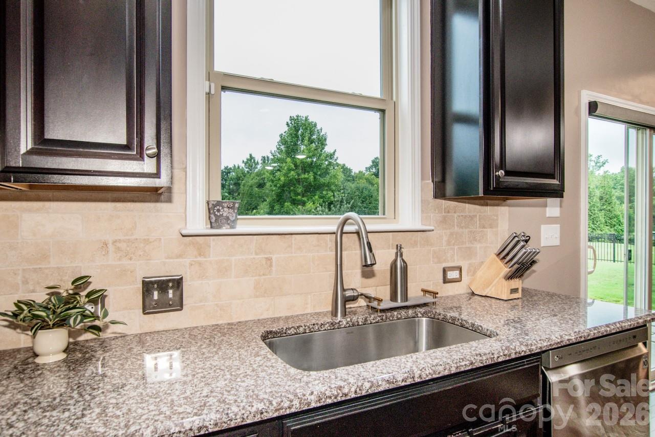 Wooded views from kitchen sink window - 130 Eagles Landing Drive, Mooresville