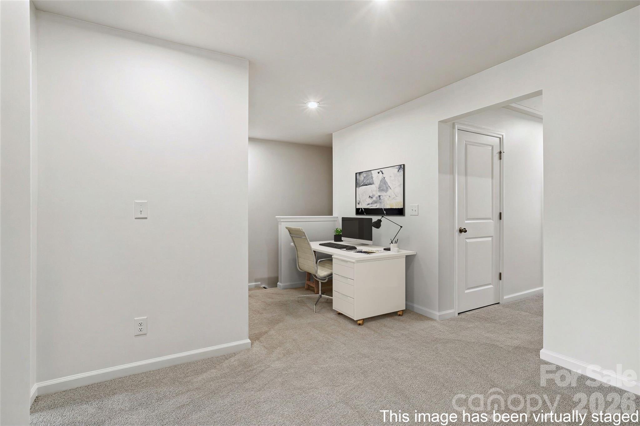Virtual staged area in the upstairs loft. This floorplan allows for a desk or sitting area. - 608 Cassidy Court, Clover