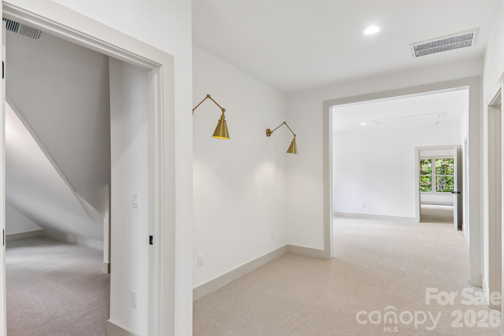 hall showing storage and loft and door to bonus room - 318 Mountain Home Trail, Brevard