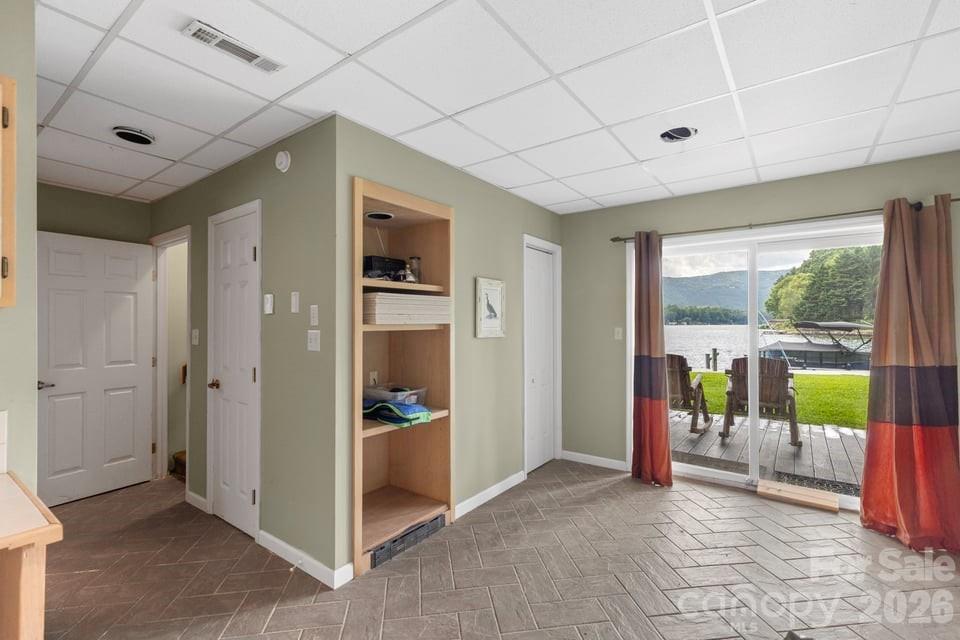 Lower Level Fully Finished with Full Bath and Sliding Doors to the Patio and Dock - 82 Innsbrook Drive, Lake Toxaway