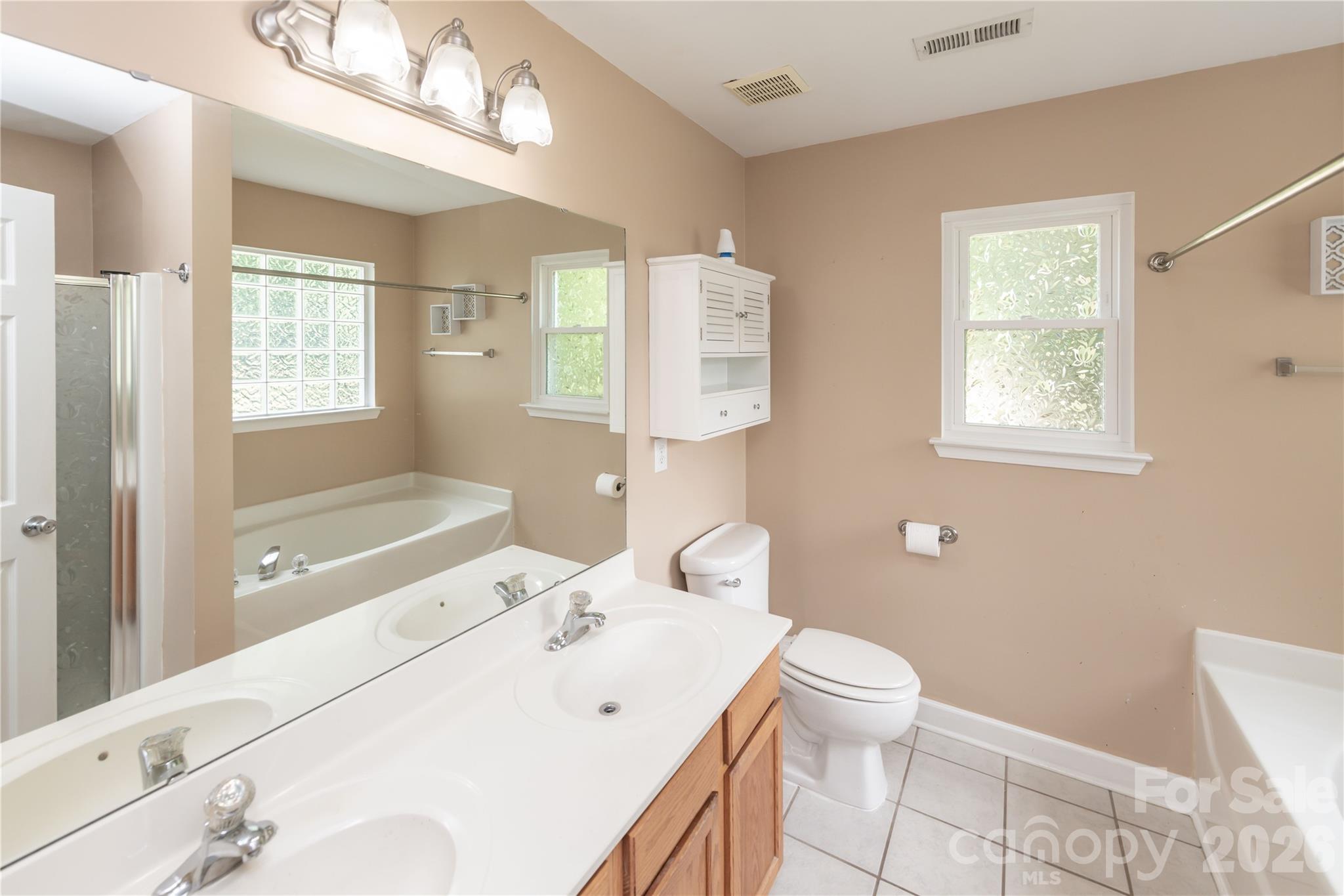 Dual vanity bathroom with walk-in shower and soaking tub - 266 Kendra Drive SW, Concord