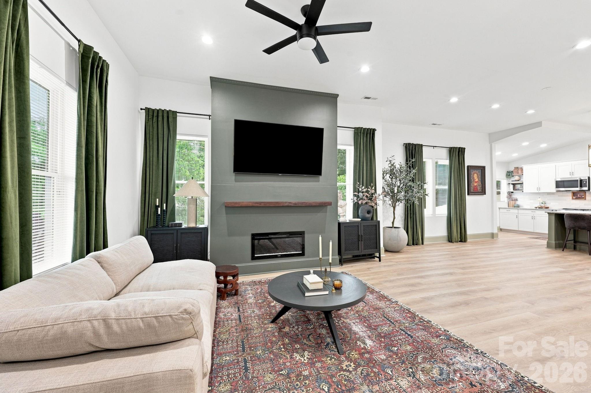The Great room with a fireplace flows into the kitchen, great space to entertain! - 527 S 2nd Street, Albemarle