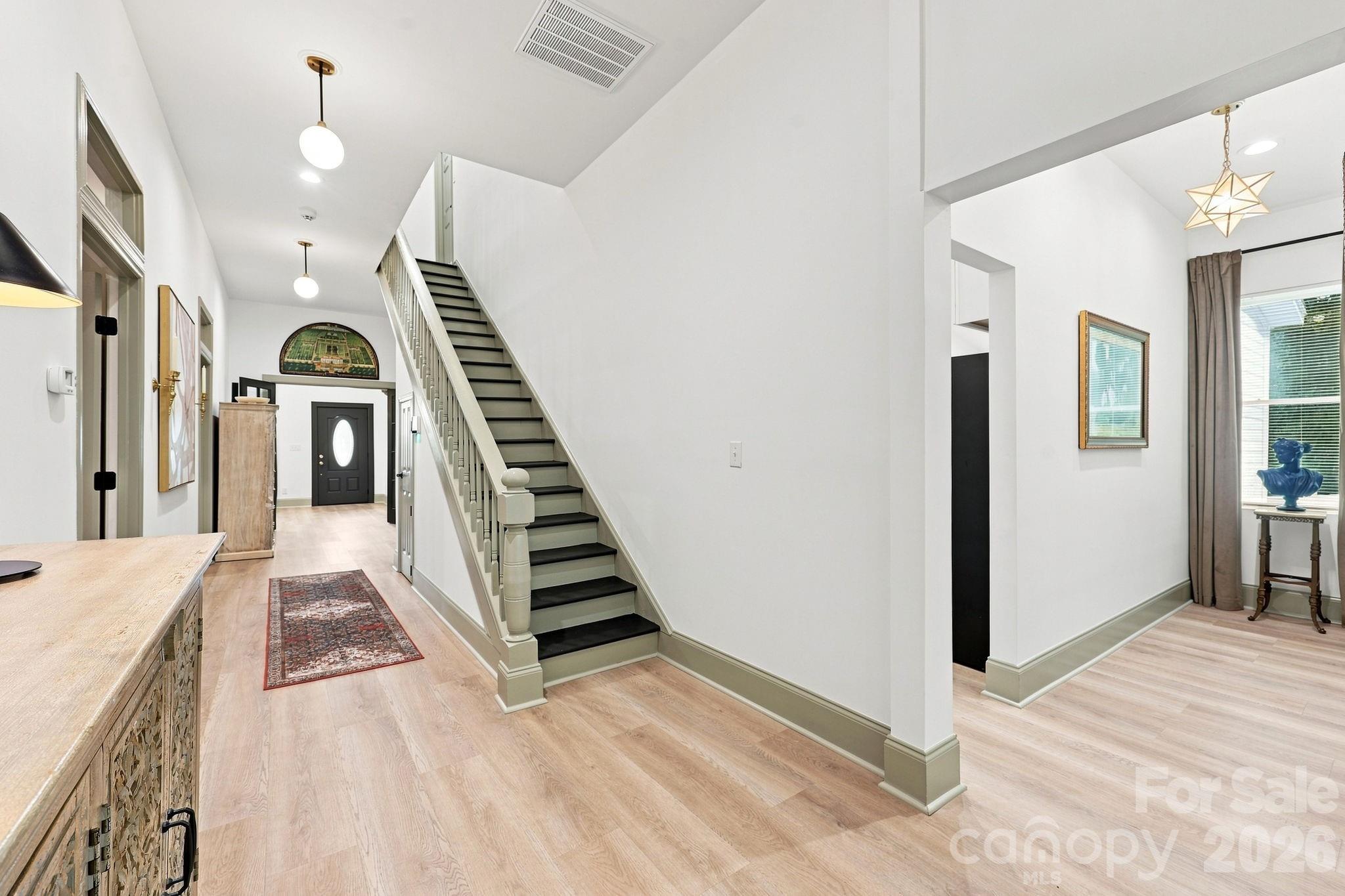 Center hallway with french doors and stairway. I love this classic design! - 527 S 2nd Street, Albemarle