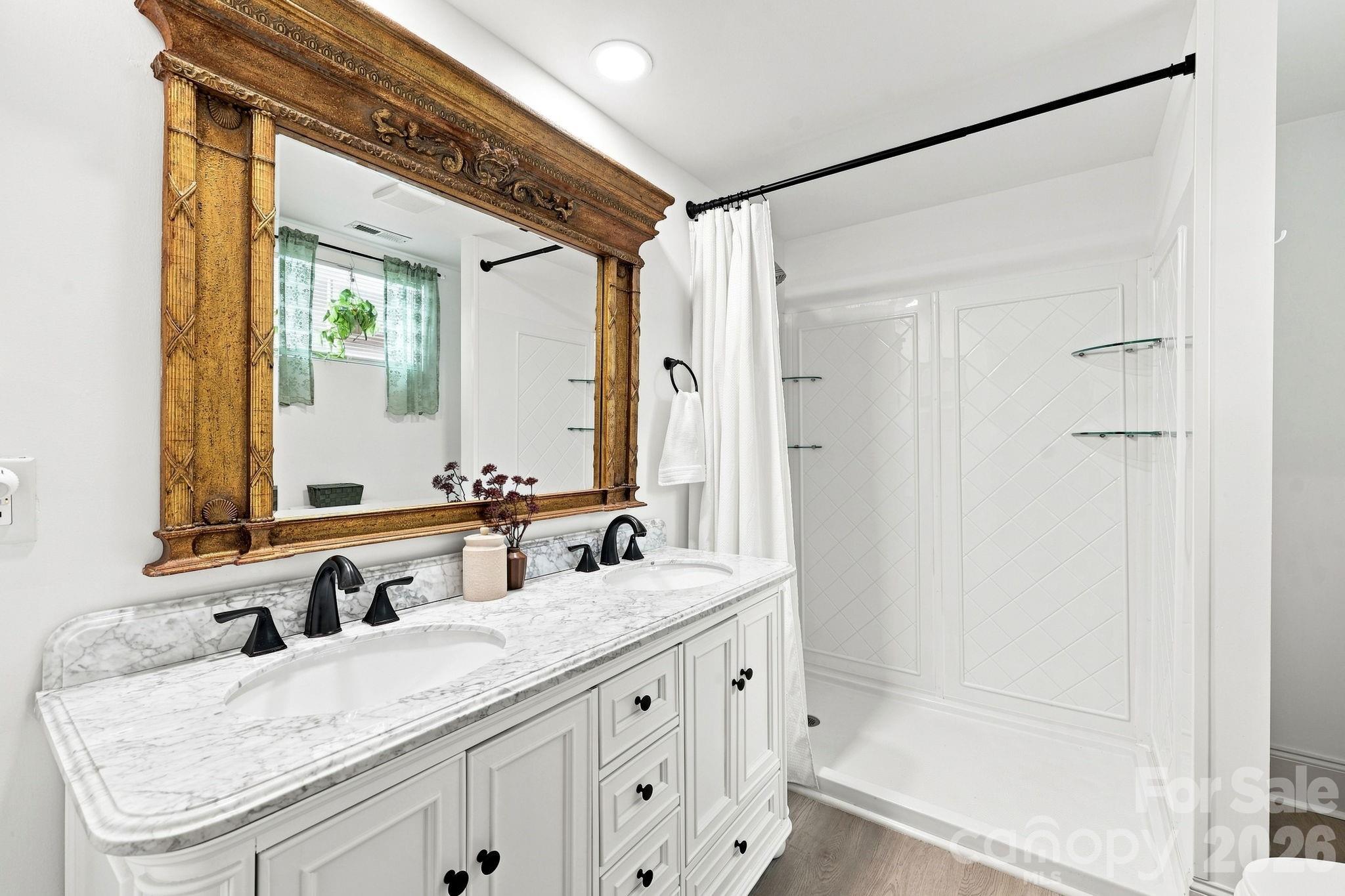 Ensuite Bathroom with walk in shower and new vanity - 527 S 2nd Street, Albemarle