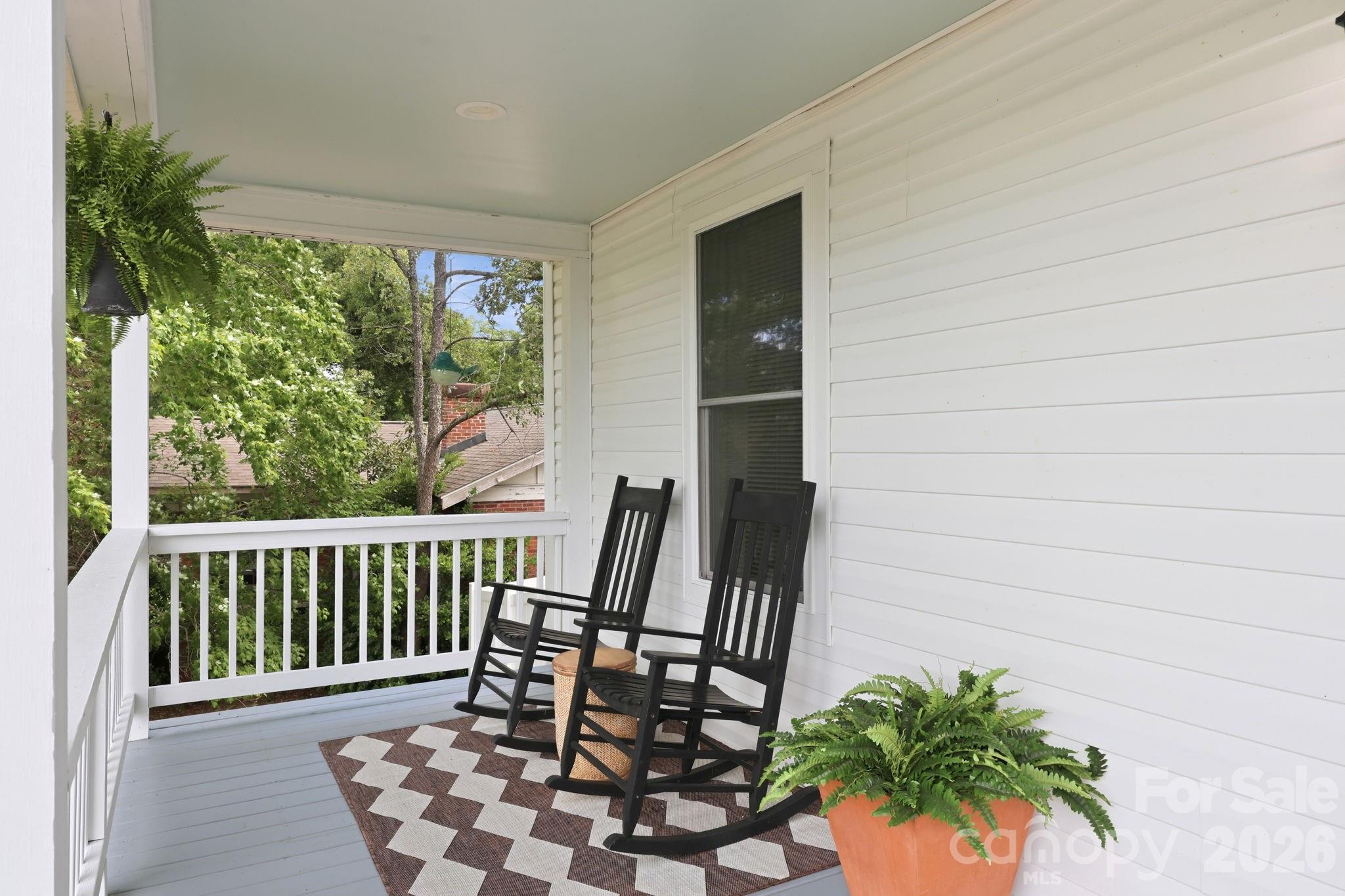 Sit in your favorite rocker on the front porch and enjoy your morning coffee. Imagine how you can decorate this wrap around porch with the different seasons! - 527 S 2nd Street, Albemarle